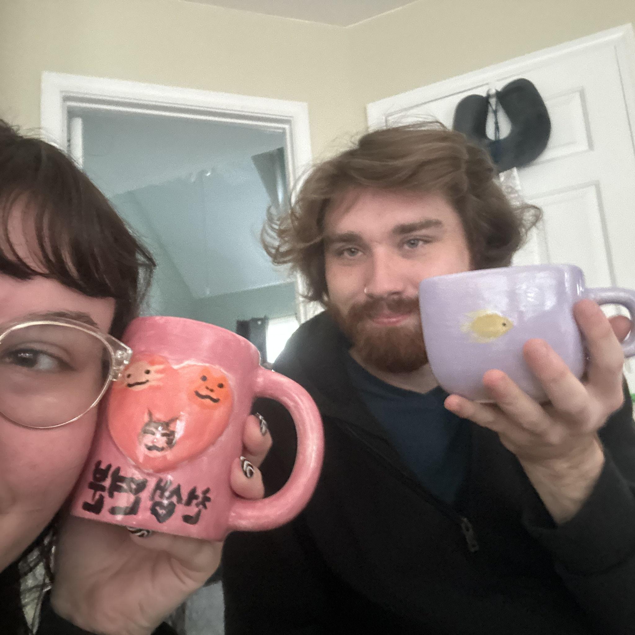 Us with our hand-painted mugs