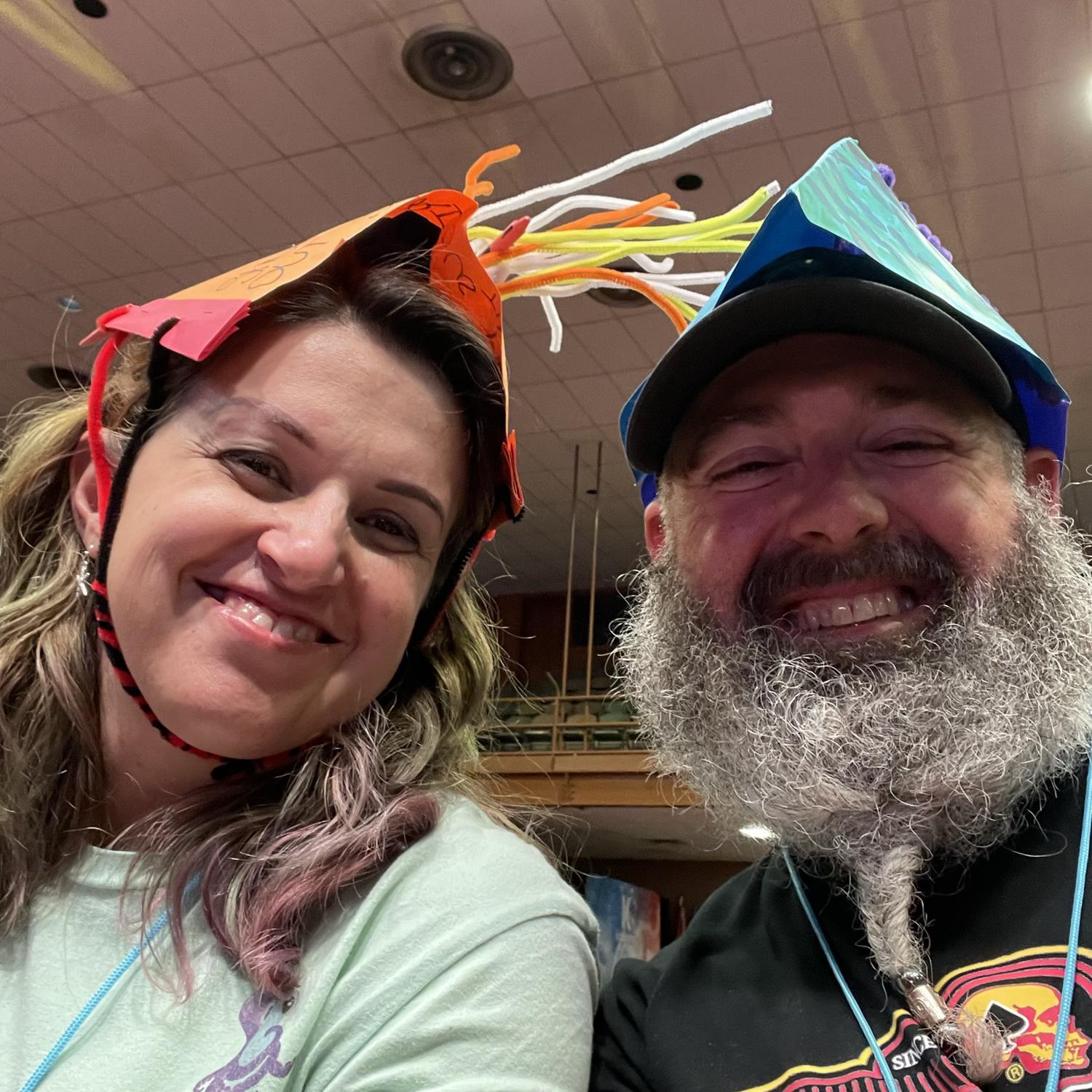 July 5, 2022. Visiting Nolan at one of his big theatre church camps. The counselors he works with wear silly hats during part of their meeting. They let us borrow some.