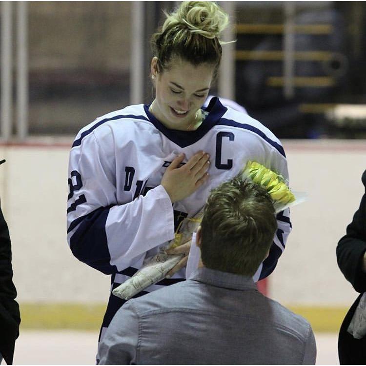 TJ proposed to Amy on the ice after her last home college game.