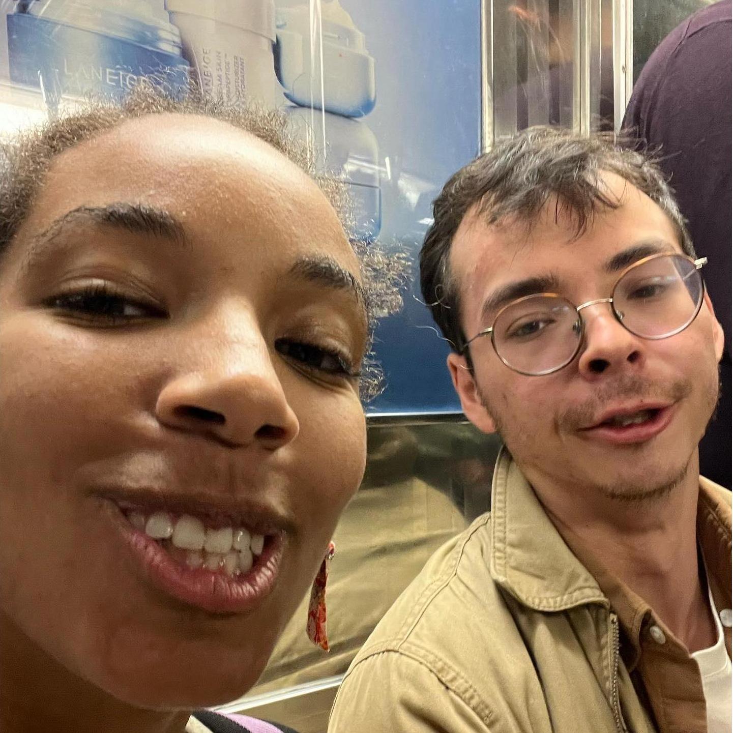 Just a couple of cuties being silly on the subway