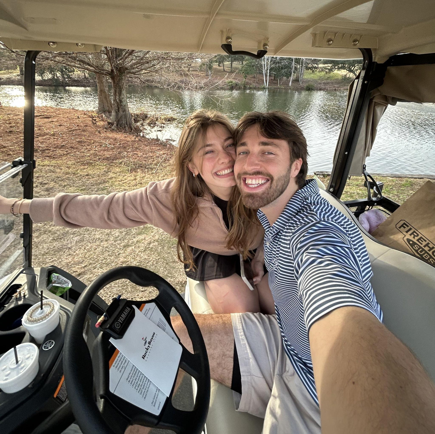 One of our favorite activities (Alex golfing & Bryna watching)
