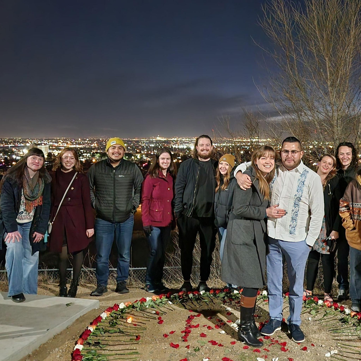 Surrounded by loved ones during Carlos' proposal. | Rodeado de seres queridos durante la propuesta de Carlos.