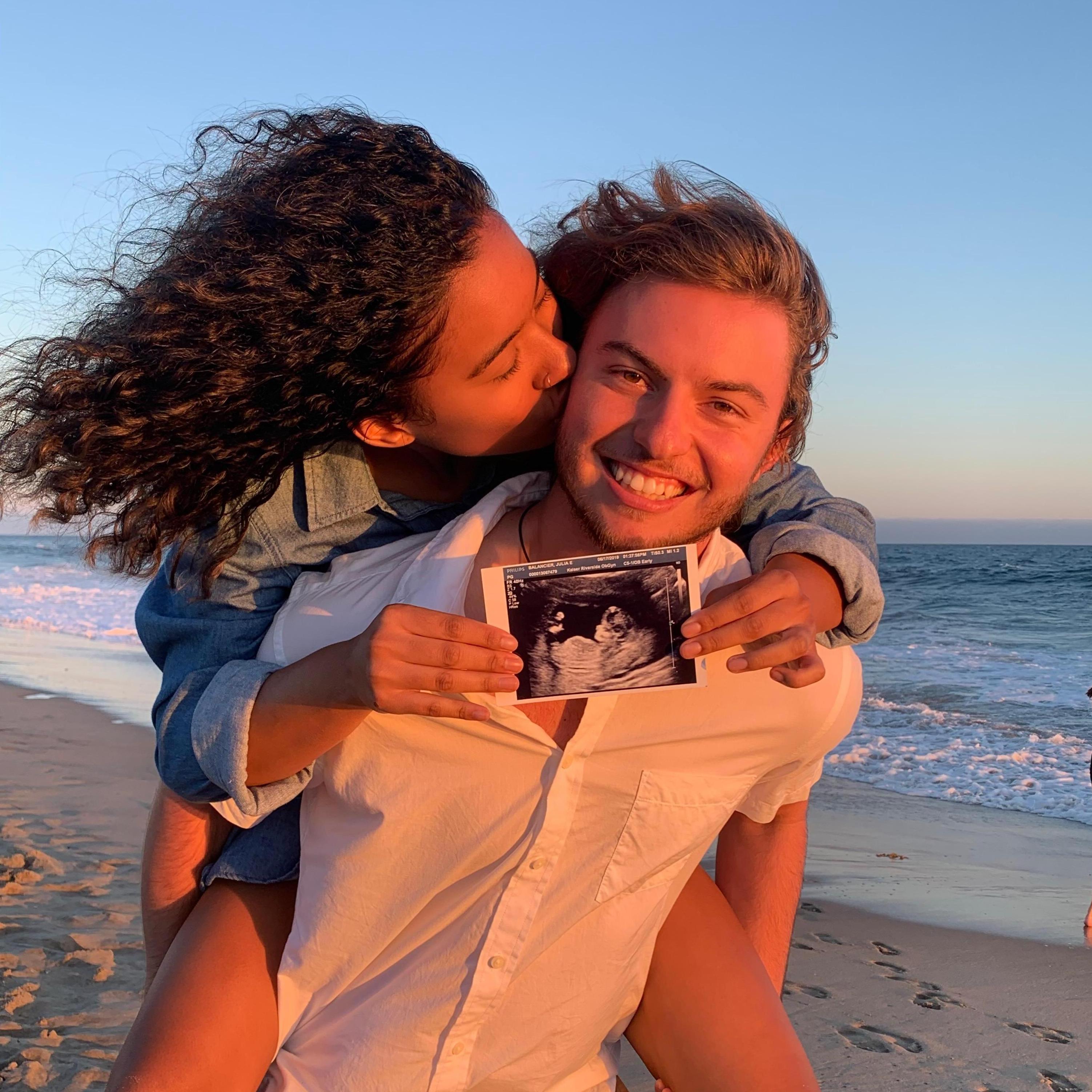 We took this photo at Huntington Beach for our pregnancy announcement.