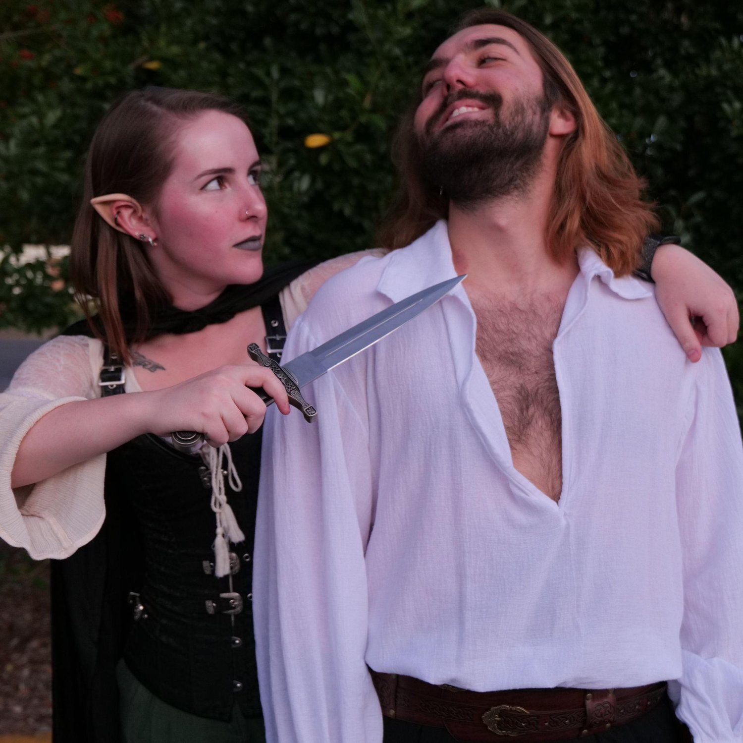 Marcel and Anna's first couple's Halloween costume, the cover a romantasy novel