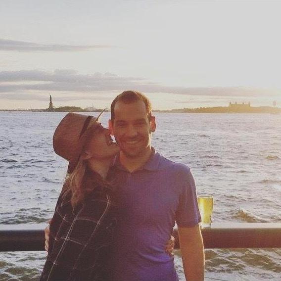 Our first trip together! Chilling on a pier at sunset in New York City
