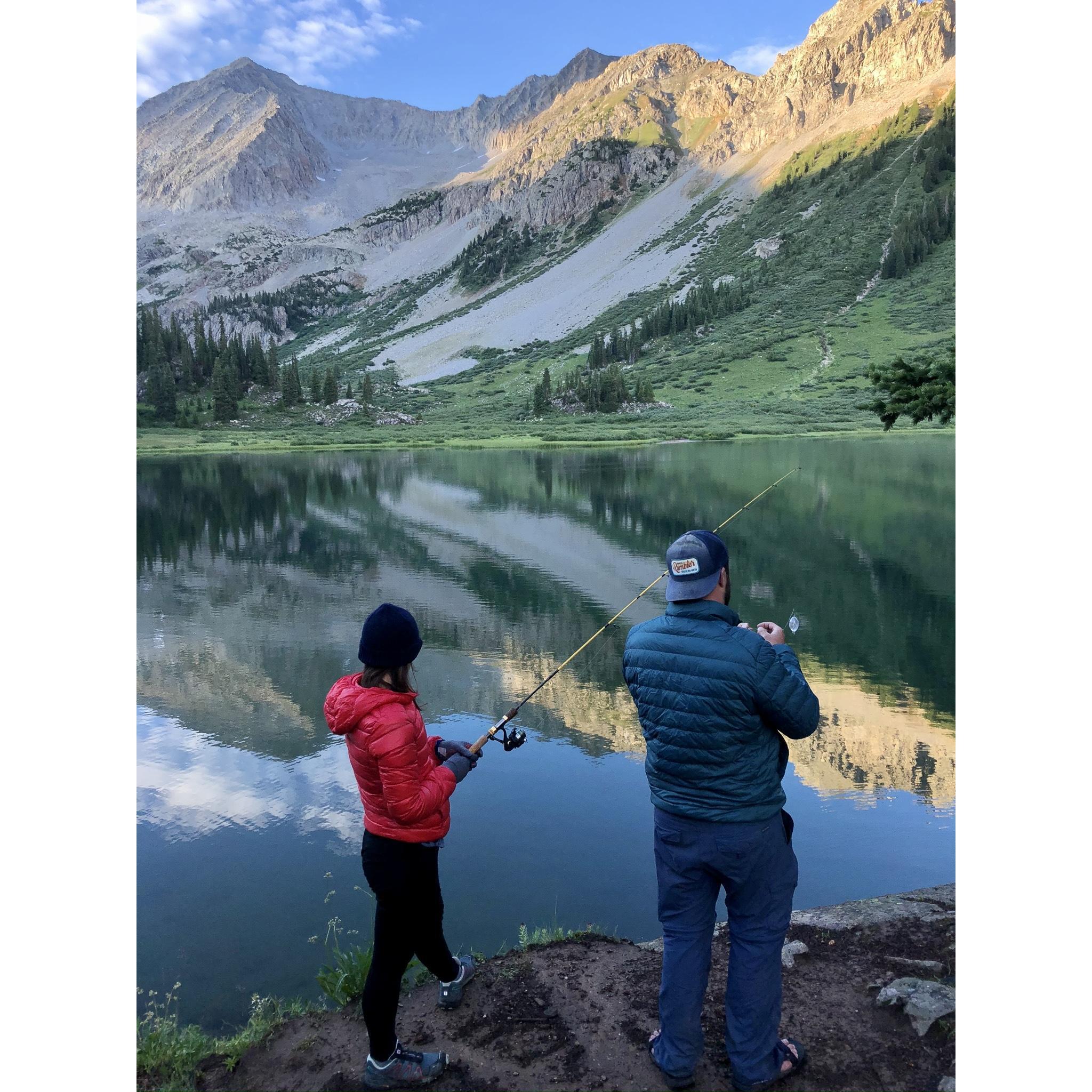 Backpacking in Colorado July 2020, Ben showing Mary how to fish at one of our campsites.