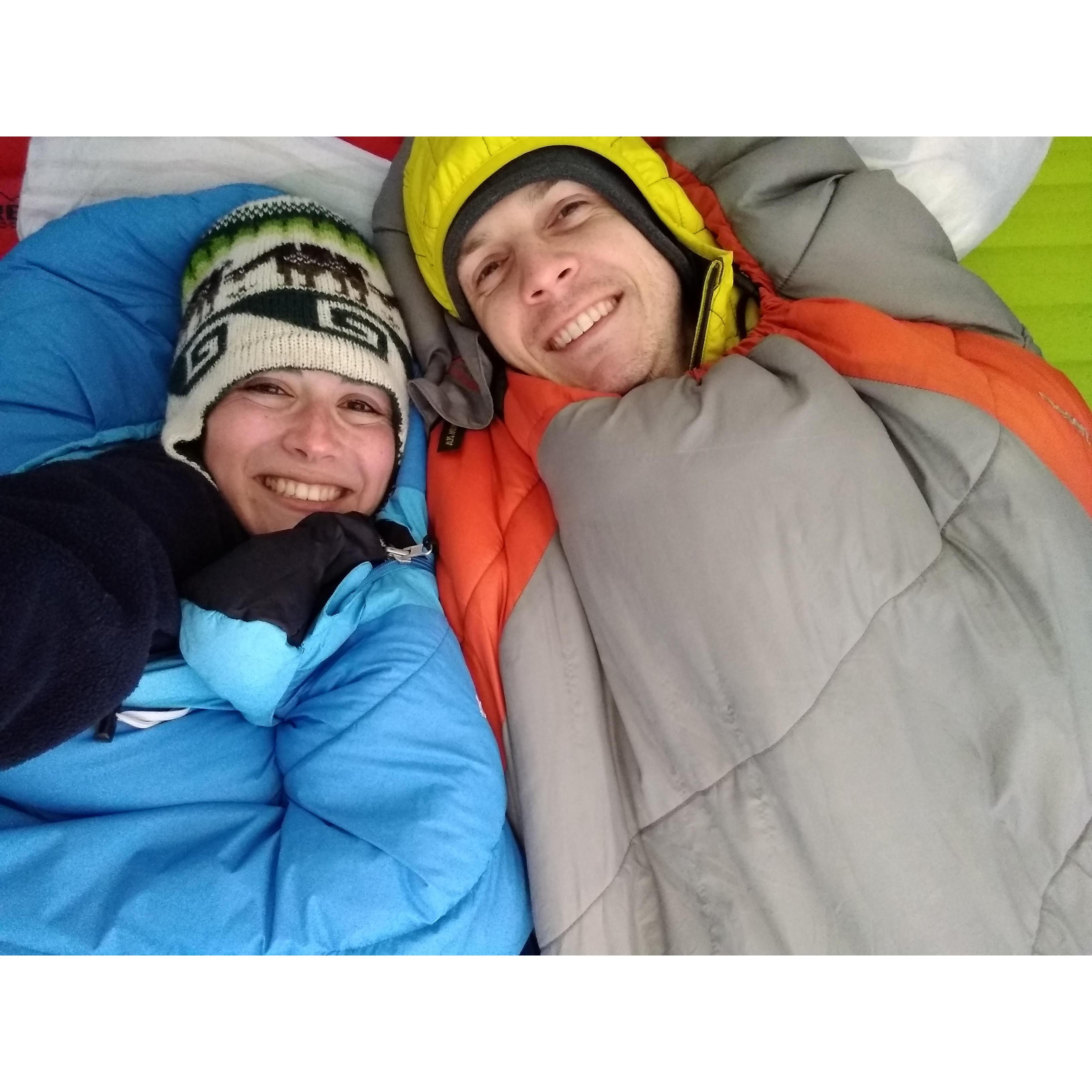Snuggling in our tent after being caught in a surprise mid-September snowfall while backpacking in Desolation Wilderness.