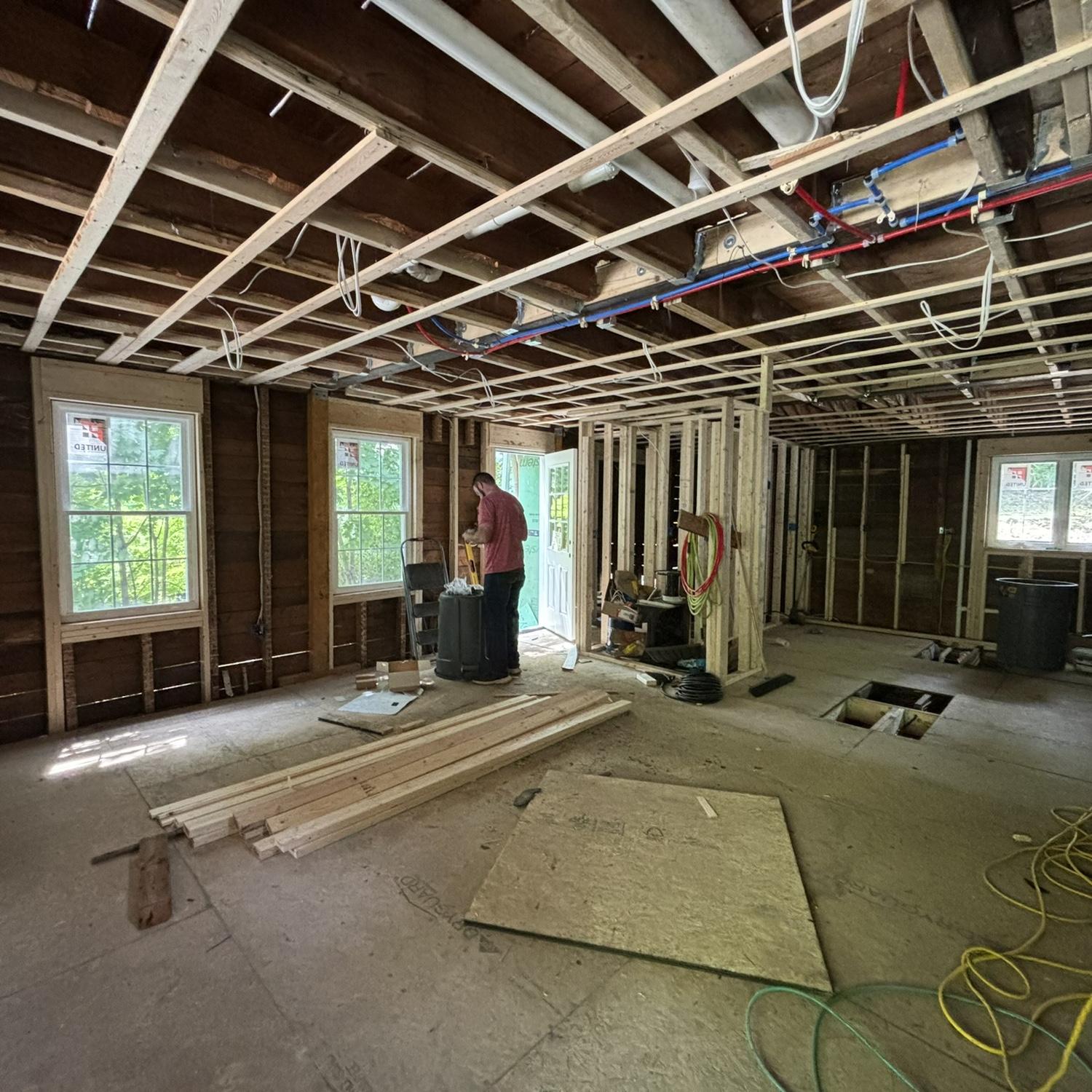 Alex, in the middle of building our first home. 2024