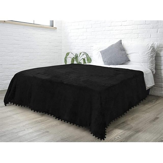 PAVILIA Fleece Throw Blanket with Pom Pom Fringe | Black Flannel Throw | Super Soft Lightweight Microfiber Polyester | Plush, Fuzzy, Cozy, Machine Washable | 60 x 80 Inches