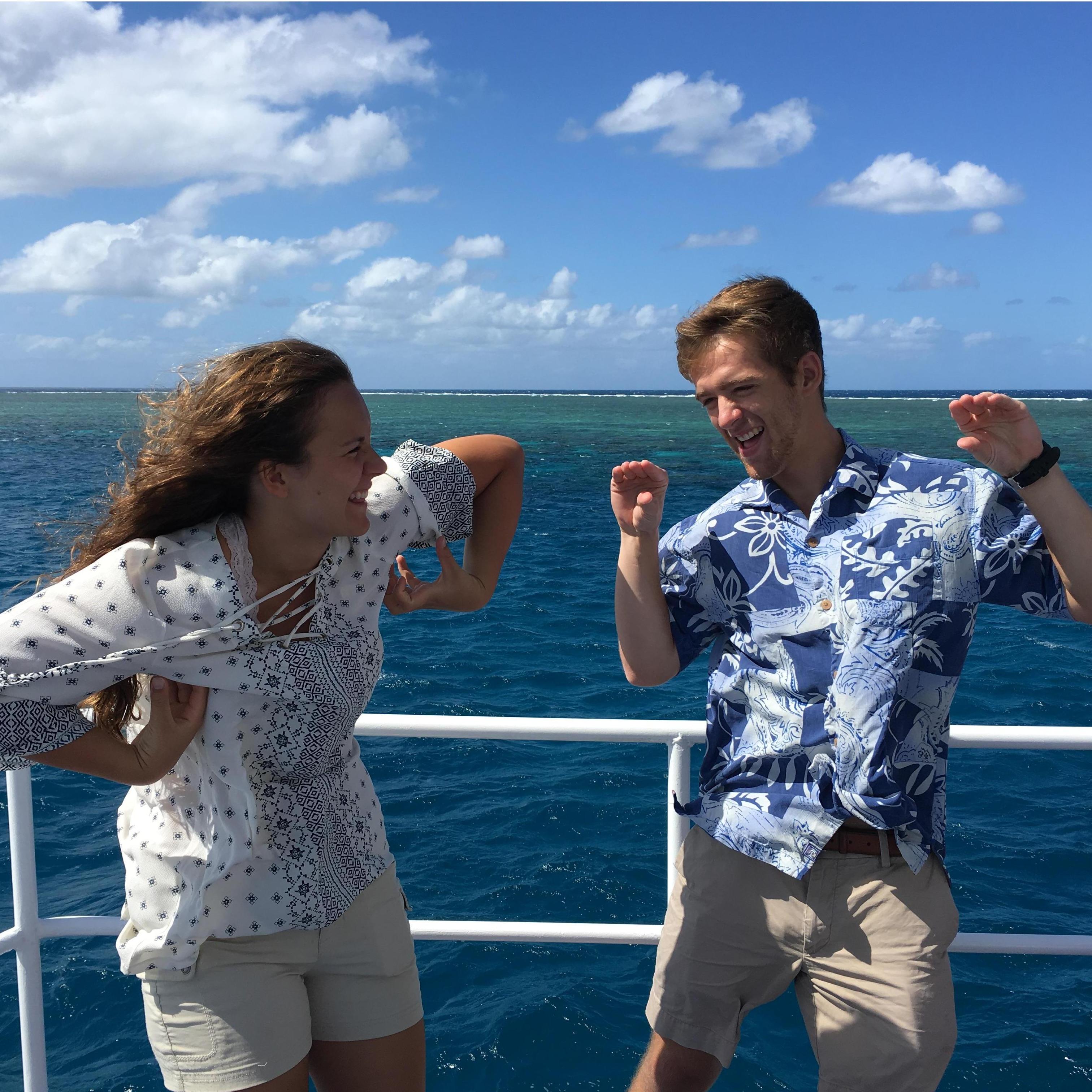 Our silly personalities coming out while trying to make the "orangutan crab" pose on our Great Barrier Reef scuba diving trip