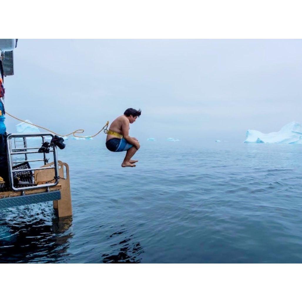 Taking a polar plunge in Antarctica after the proposal in 2020. Grace jumped right after this photo!