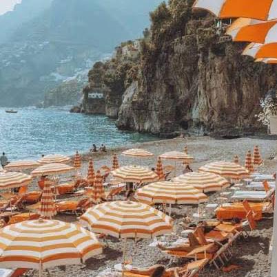 Taormina beach day for two — lounge chairs & umbrella