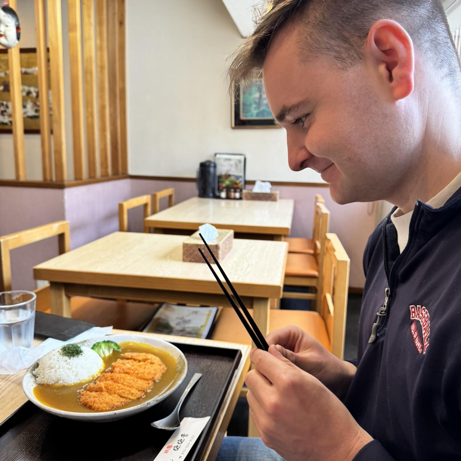 Mar 2025: Sam has noticed that most of her phone photos are of Jackson eyeing food as if it were his soulmate. This one was taken while we were in Japan