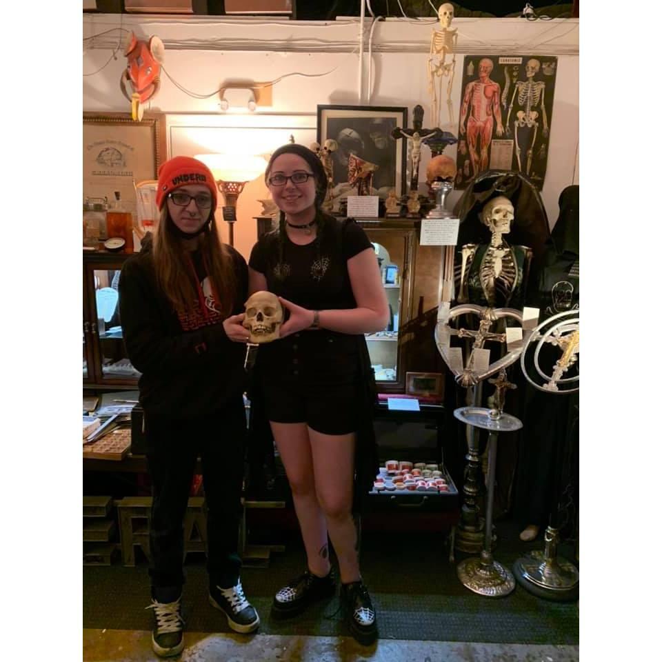 Holding a human skull at the Museum of Death.