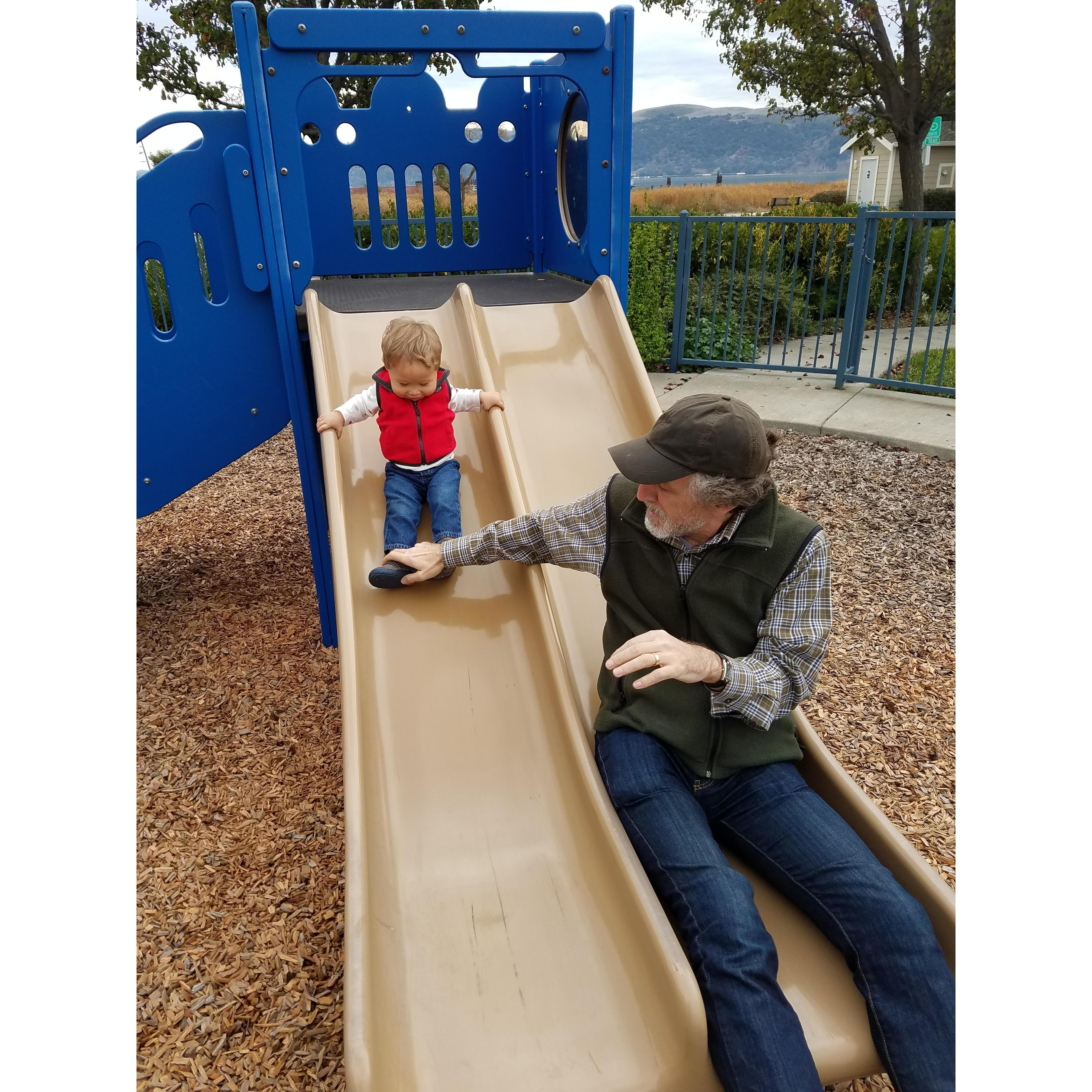 Sliding with Grandpa at the park