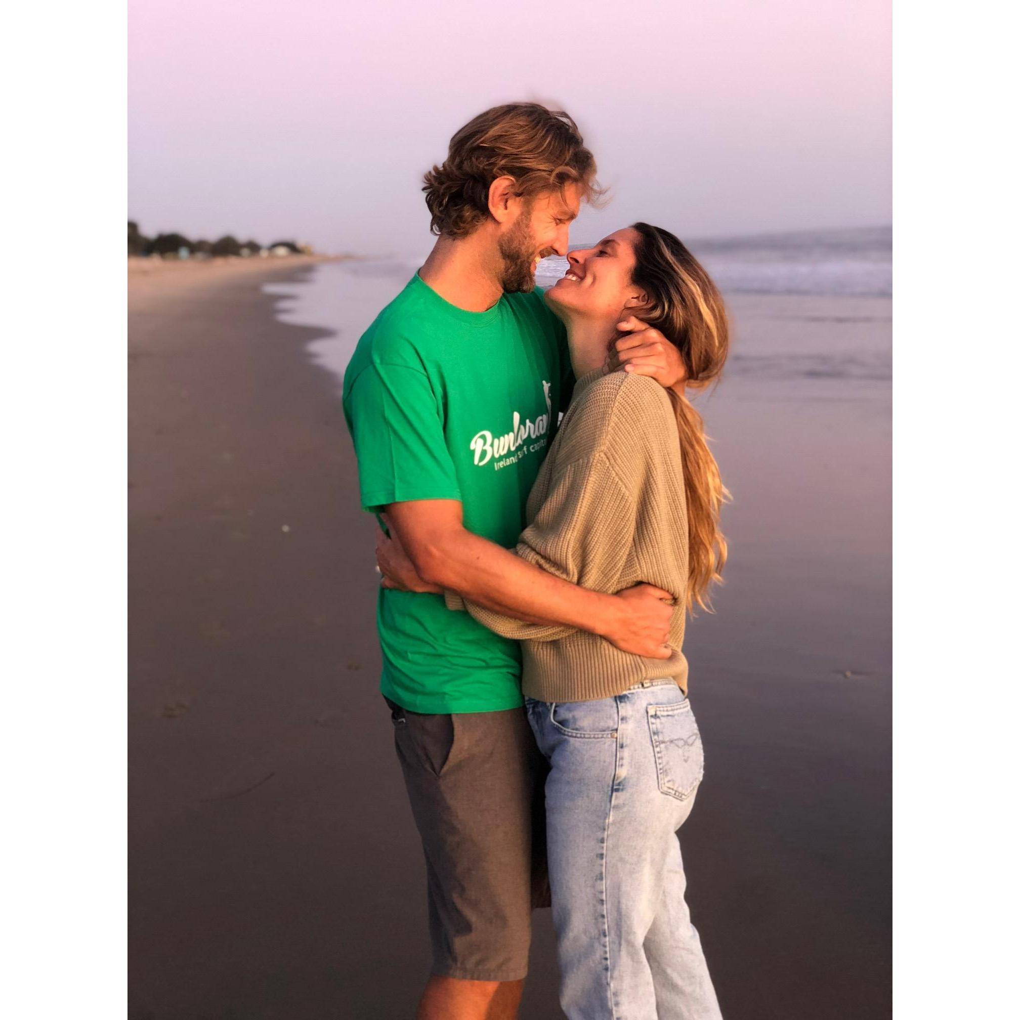 On a sunset walk in Carpinteria (the same beach where their love began).