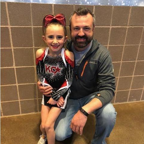 John and Kenzie at her cheer competition.