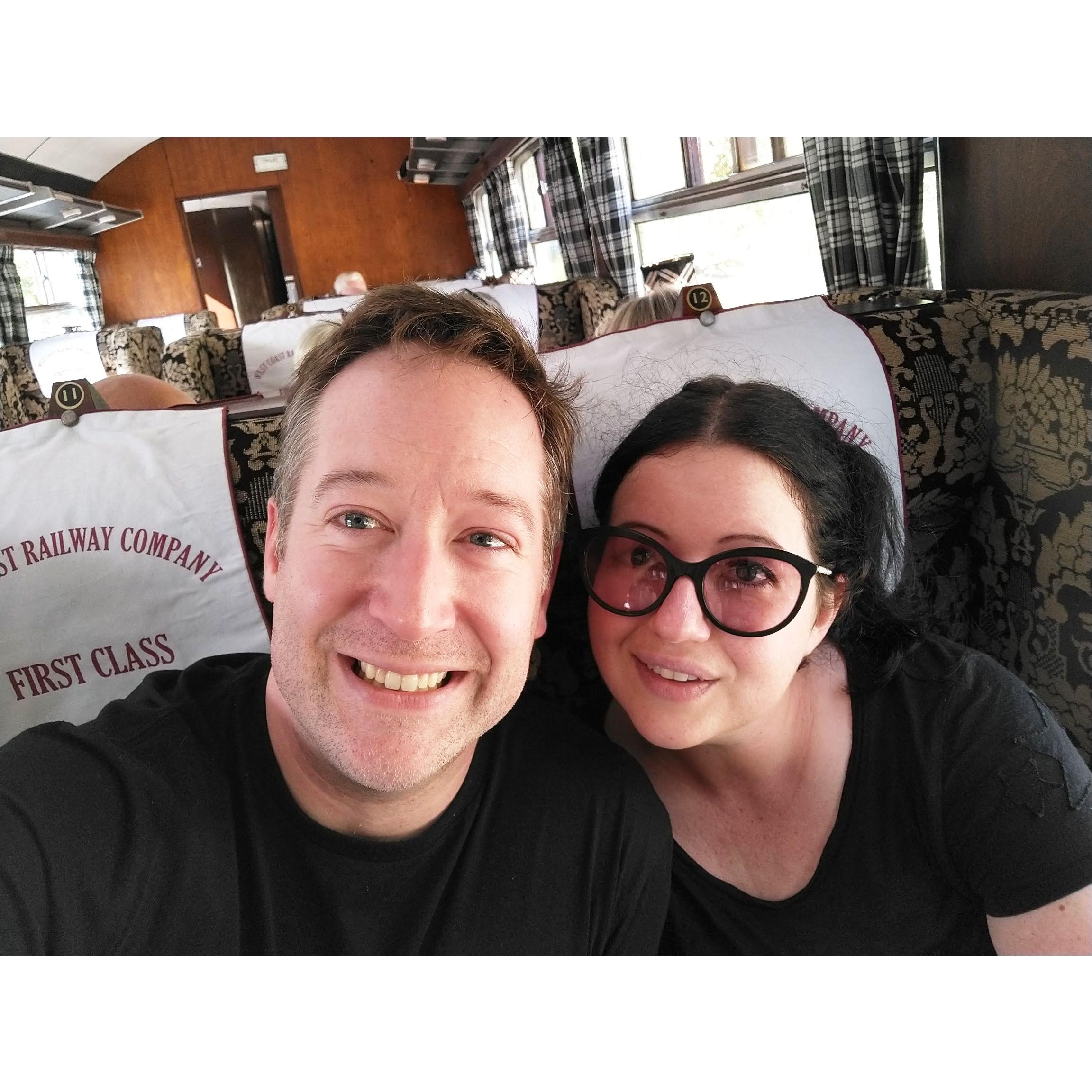 Aboard the Jacobite train in Fort William, Scotland, two days after Andy proposed (2022). Andy had originally planned to propose aboard the train but couldn't wait.