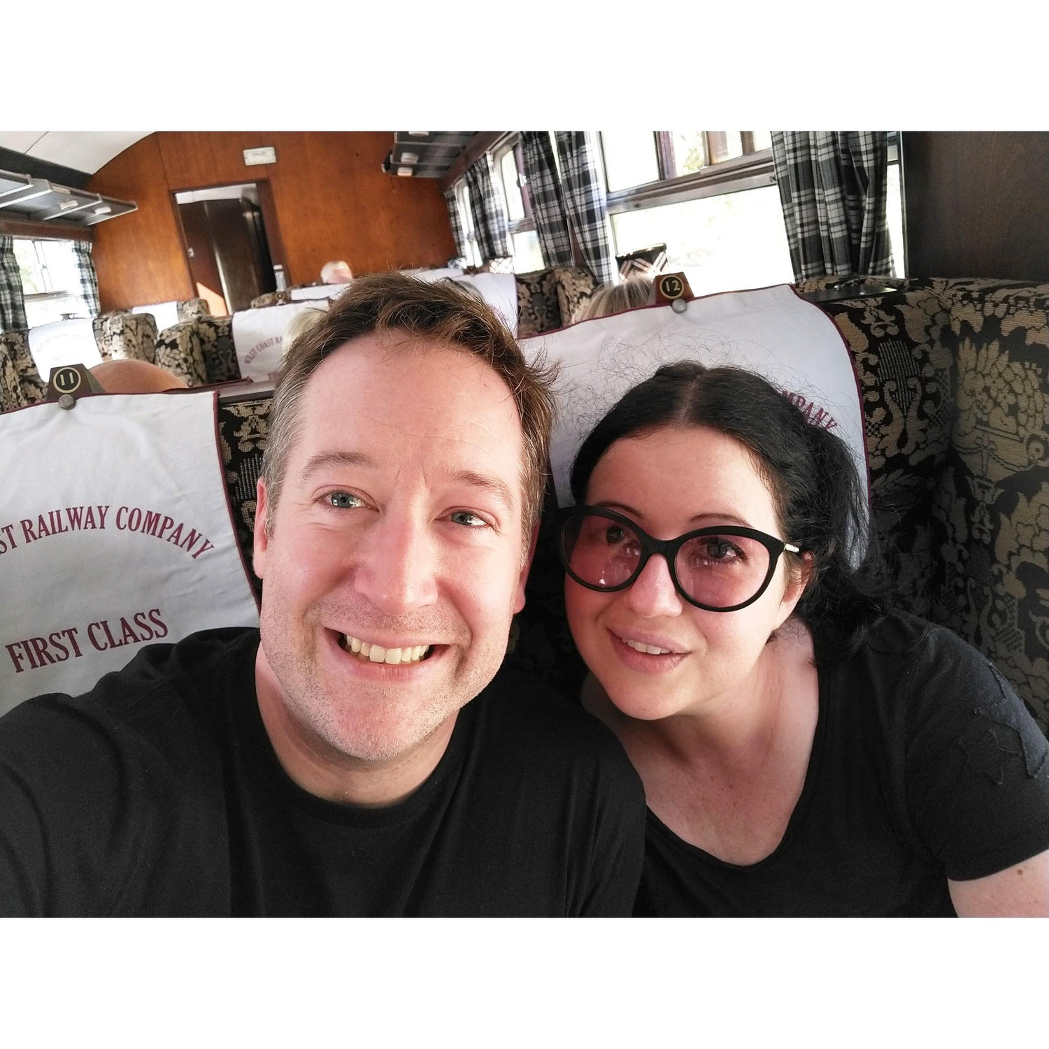 Aboard the Jacobite train in Fort William, Scotland, two days after Andy proposed (2022). Andy had originally planned to propose aboard the train but couldn't wait.