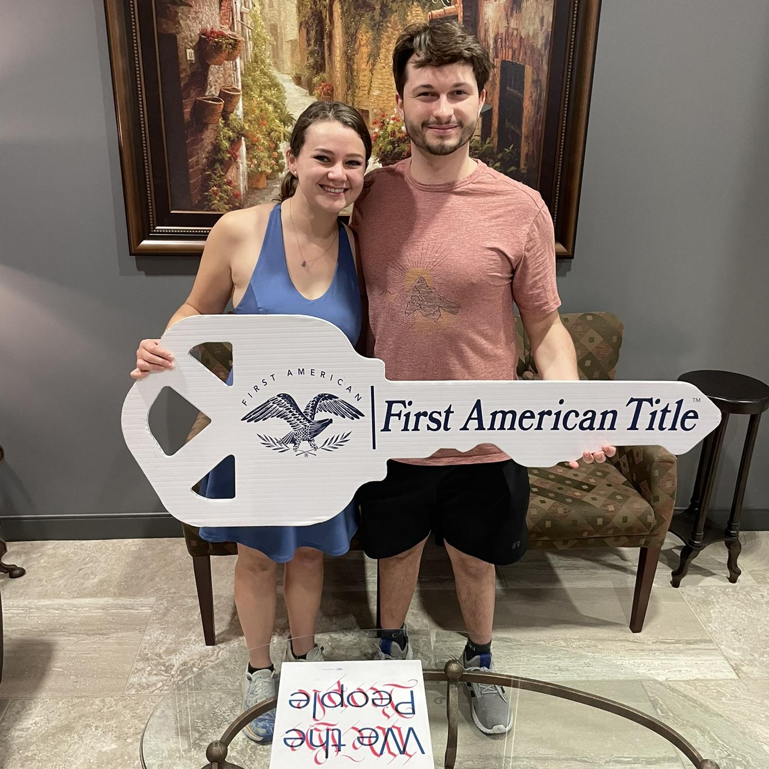 Signing the paperwork on our first house!