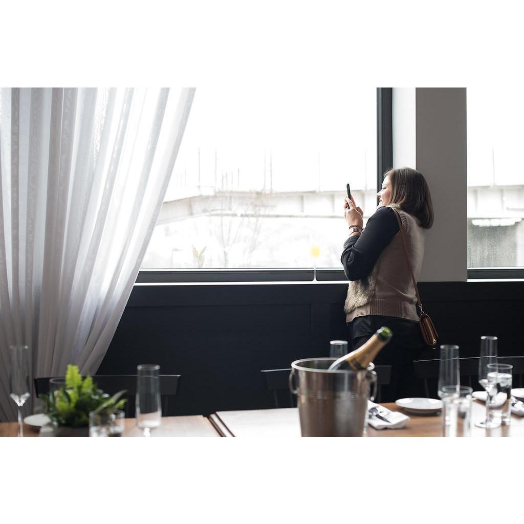 Hailey's sister, Catherine, trying to sneak a peek of the proposal out of the window