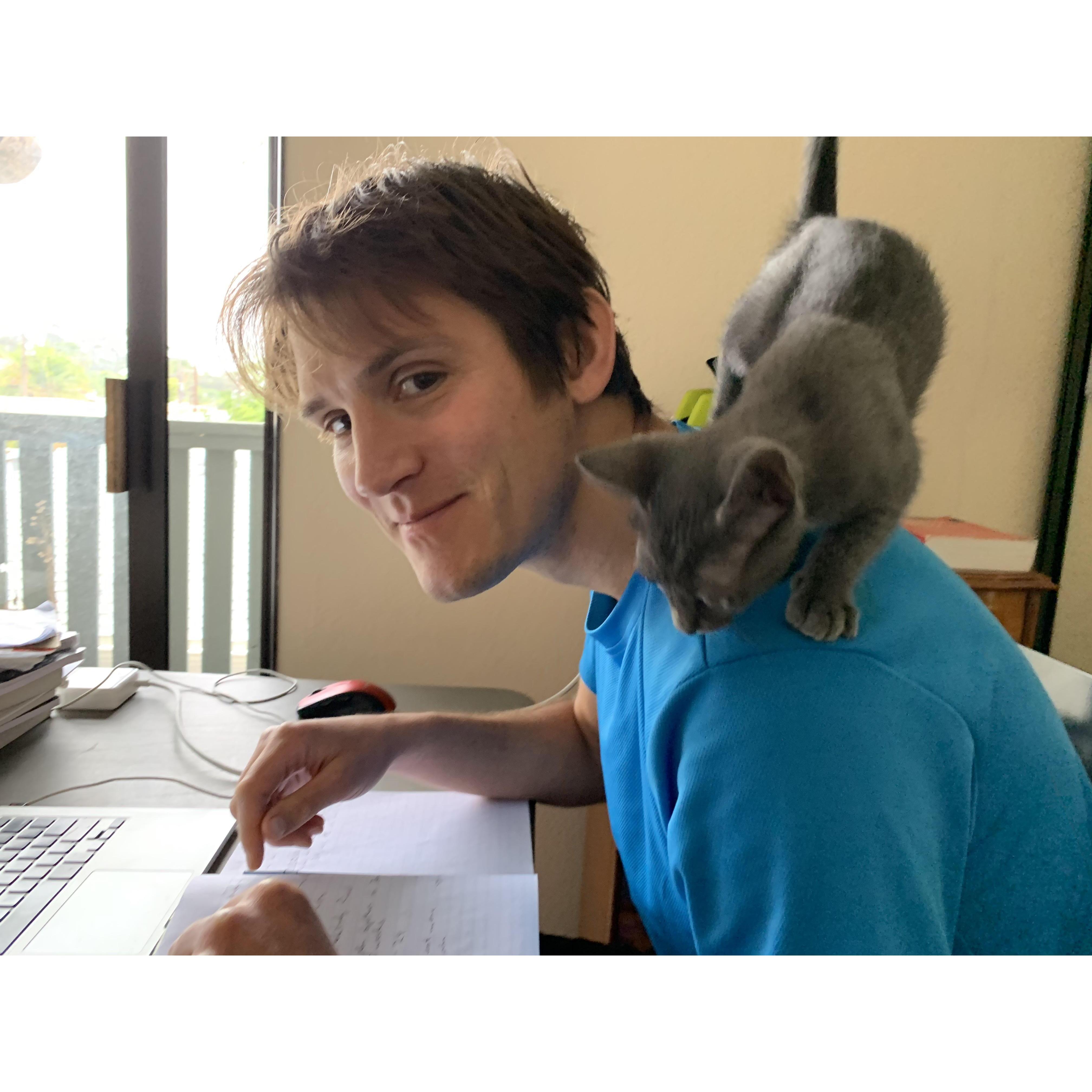 Elvie helping Chris work.
