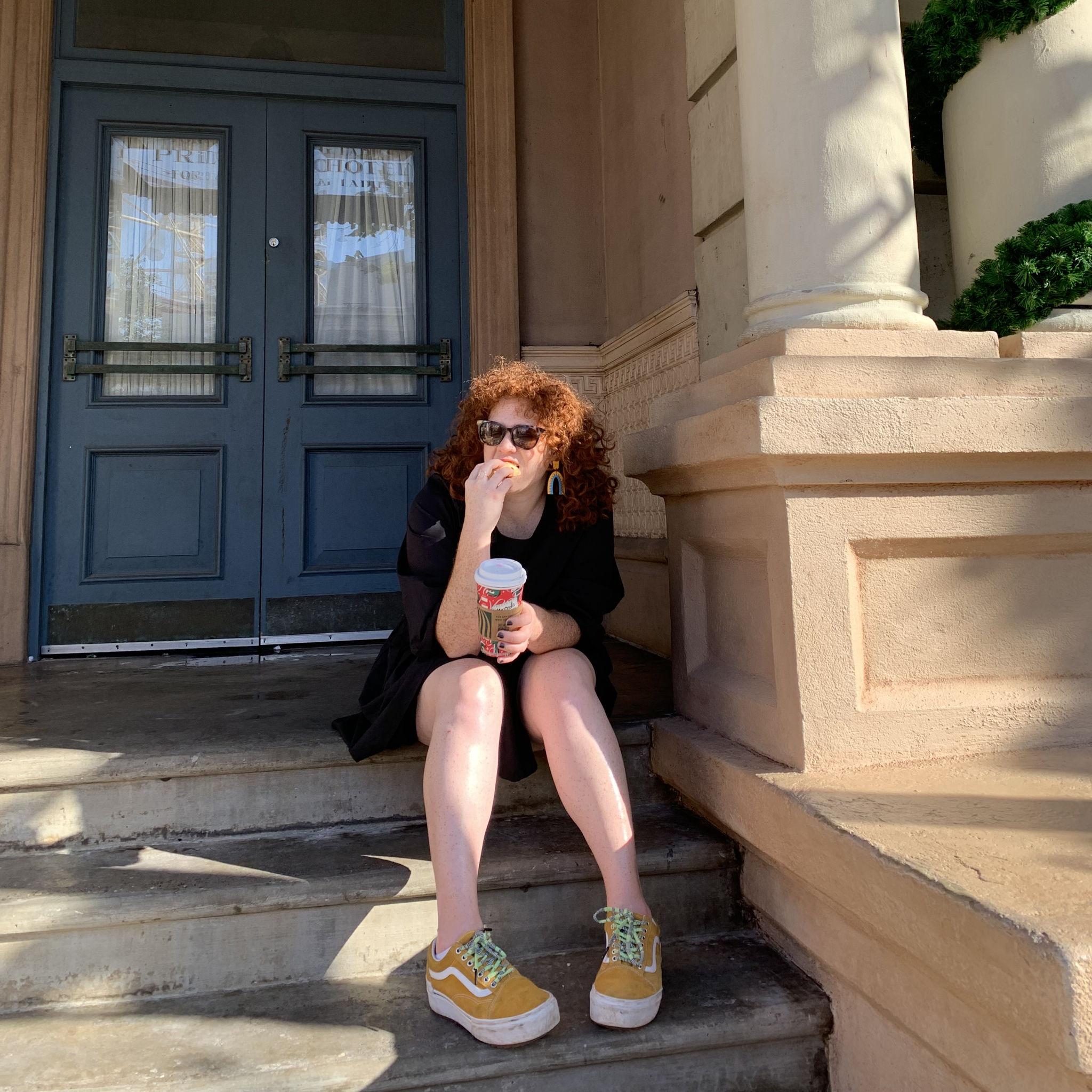 Sometimes you have to eat a pastry on the universal studios version of Carrie Bradshaw's front door, December 2021