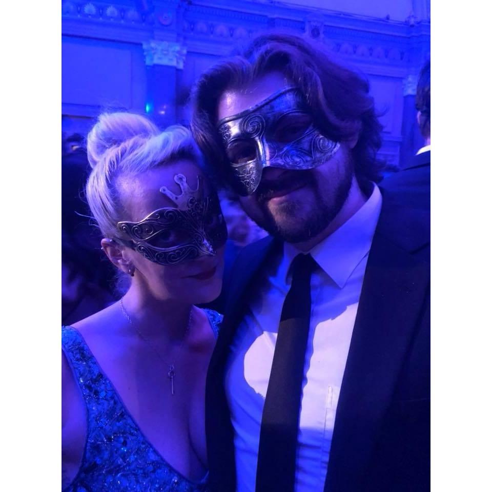 Who are those masked figures?  Nobody knows, at the Illuminati Ball.