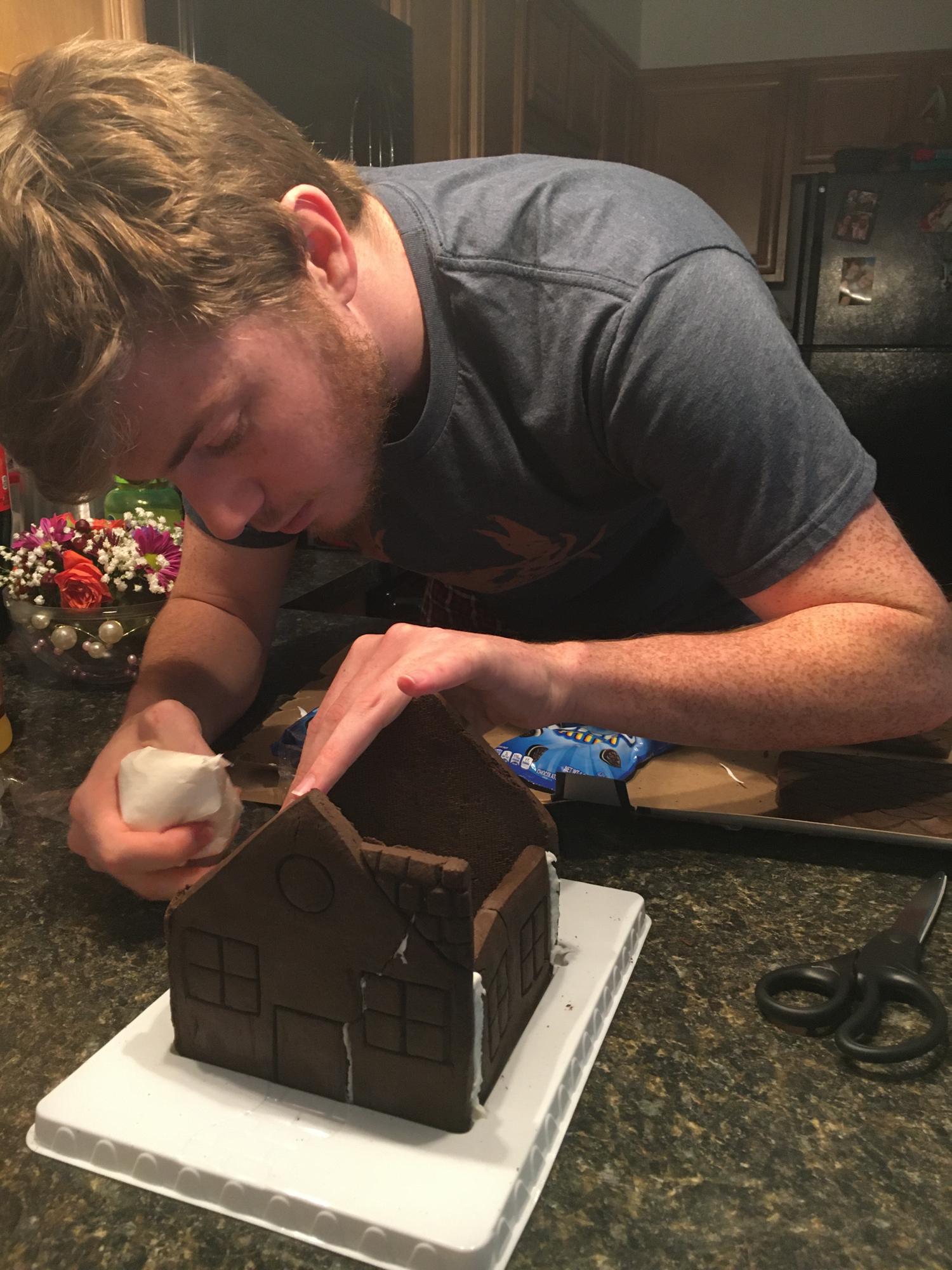 Zach was hard at work building that Oreo gingerbread house she desperately wanted.