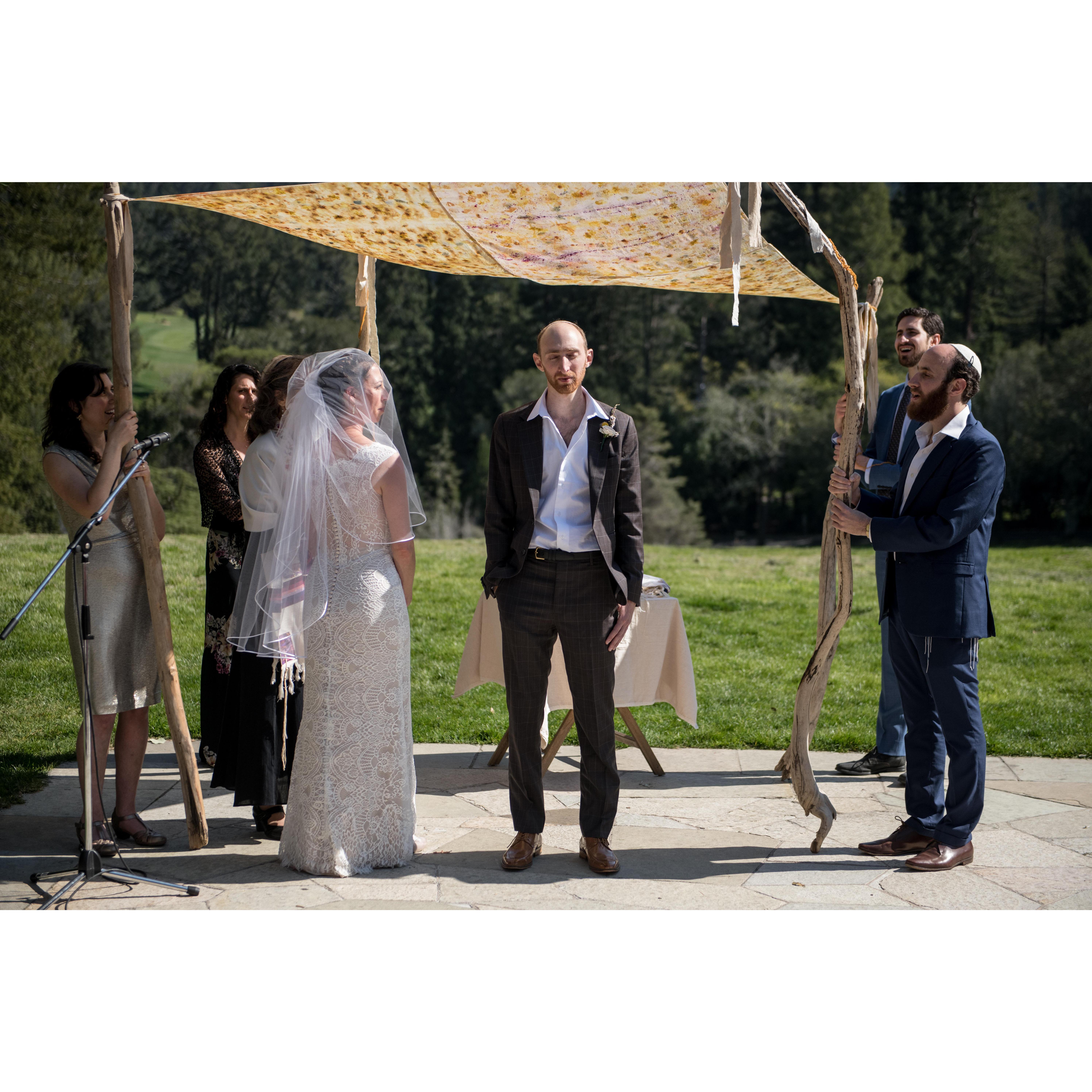 Tamara circling Yonatan under the chuppah