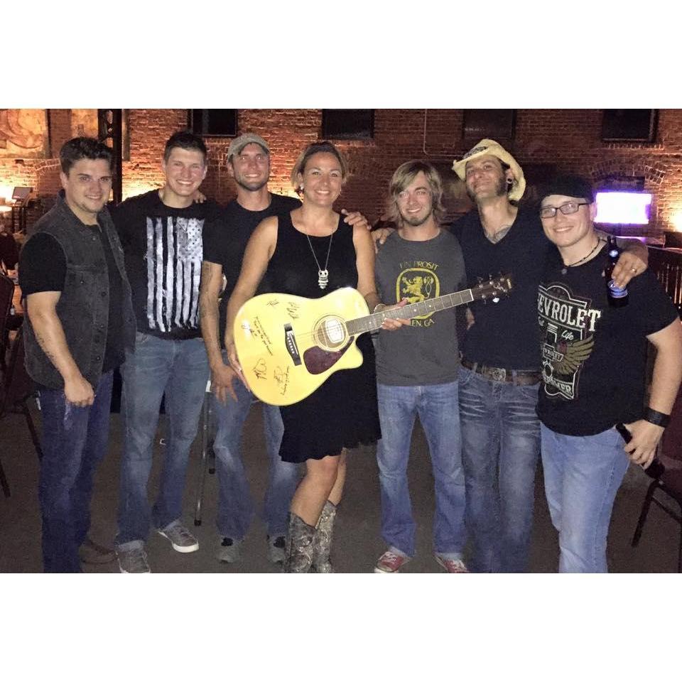 Daniel got my favorite band to sign a guitar for my birthday!