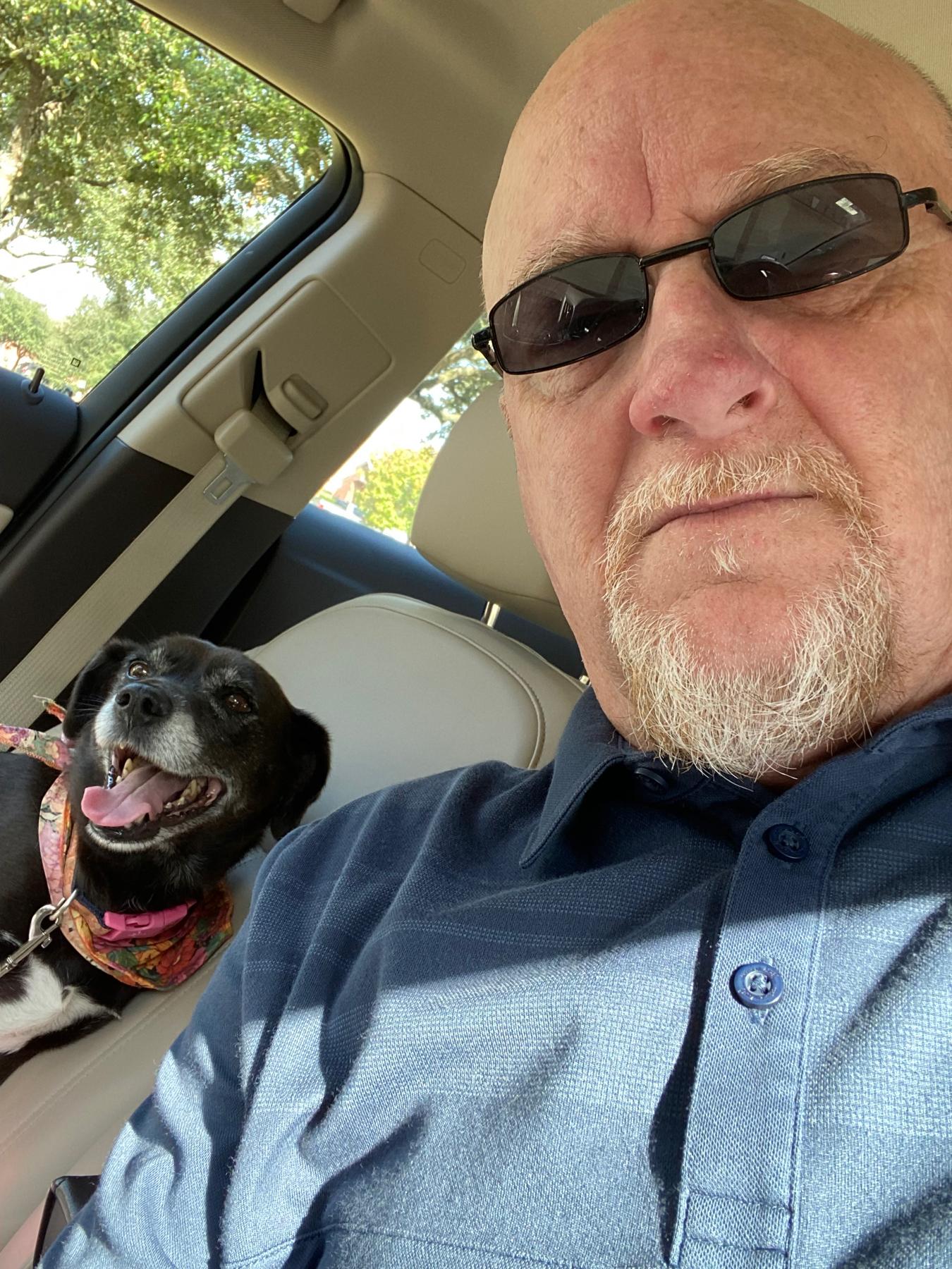 Dennis and his step dog, Biscuit taking a drive.