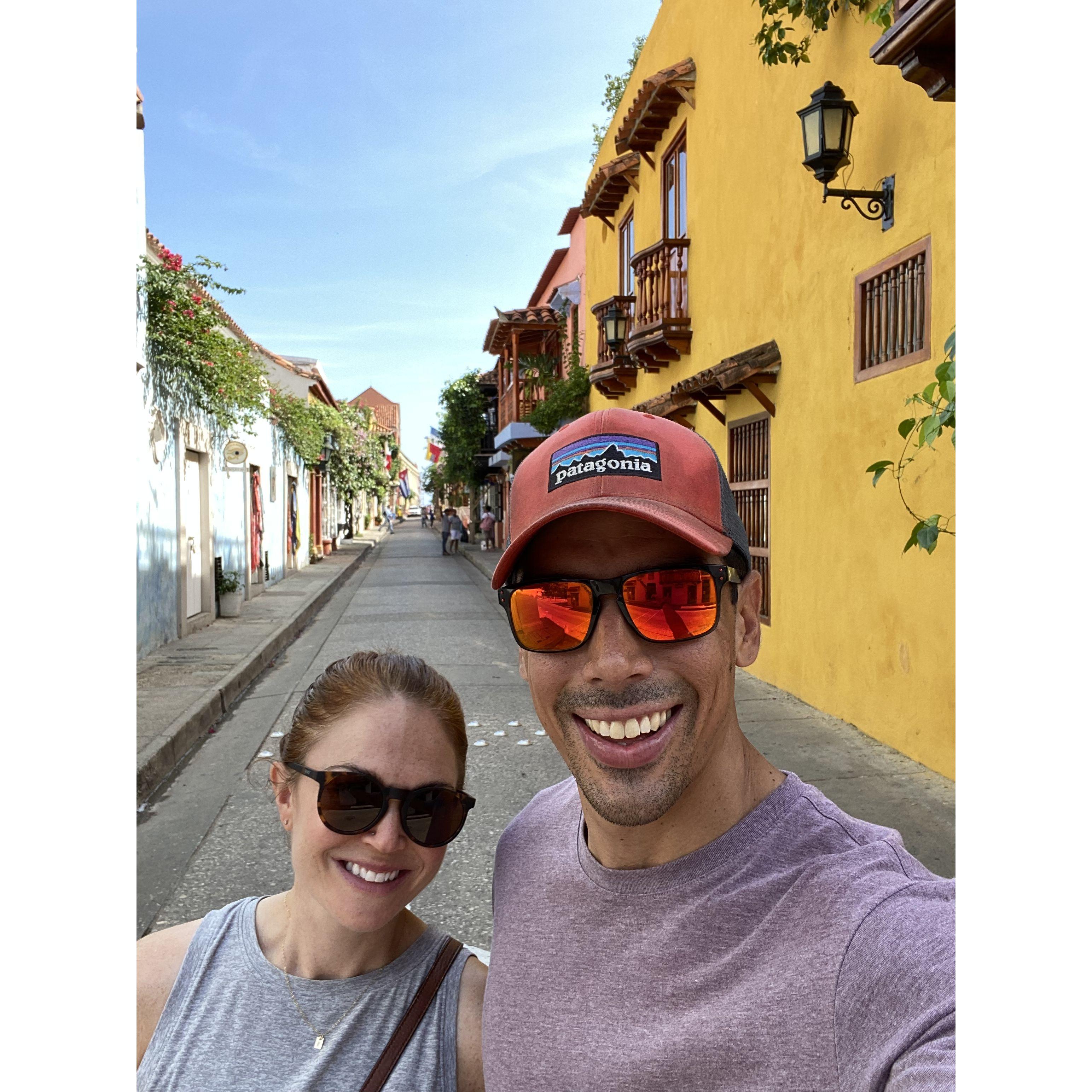 One of many photos in front of colorful Colombian buildings