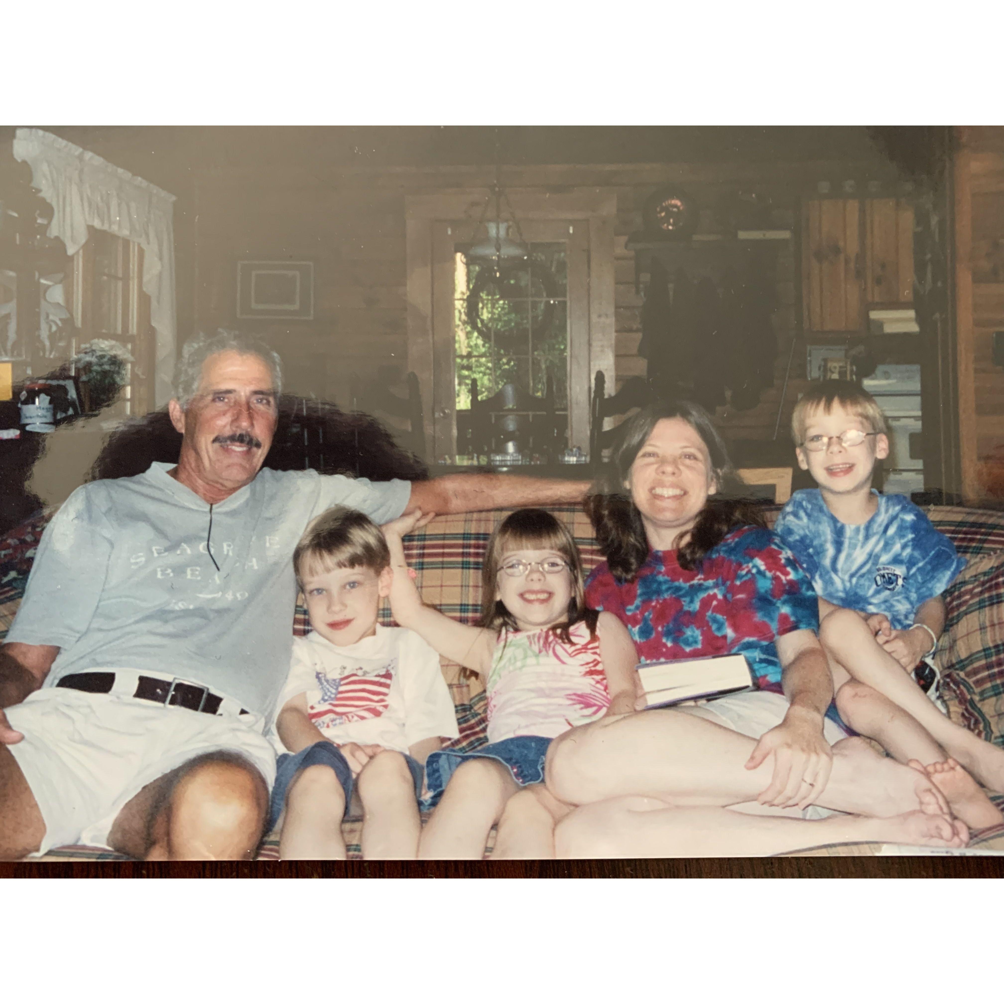 The triplets with their mother, Terri, and her father, Bob.