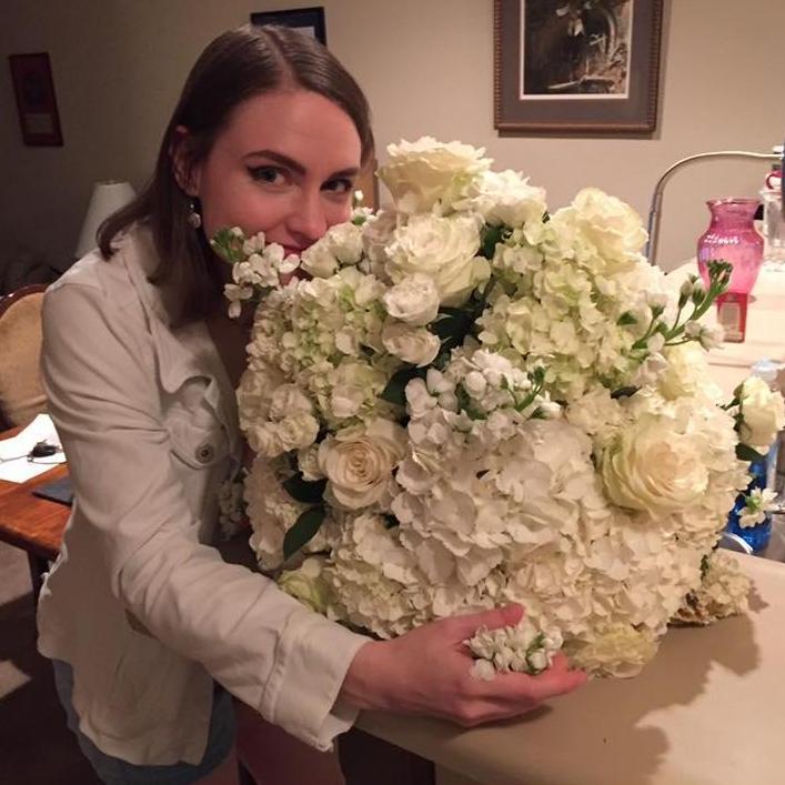 Sarah receives an impromptu gift of flowers from Robert; 2017.