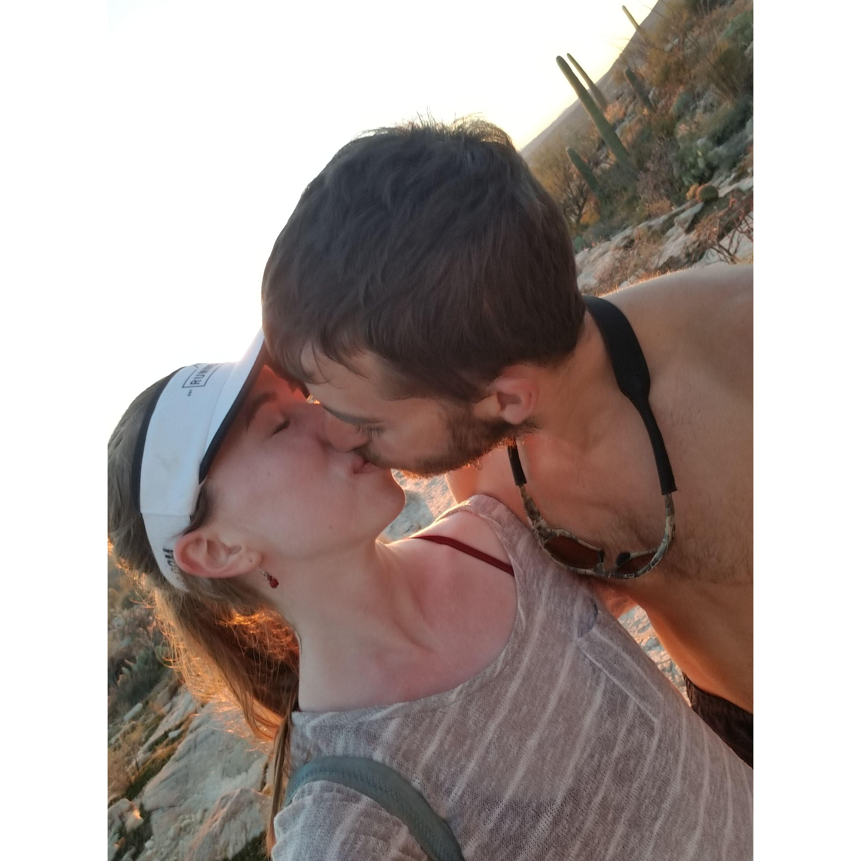 Stopping for a sunset kiss while out on a hike in the desert. - Aqua Caliente Trail, Tucson, AZ