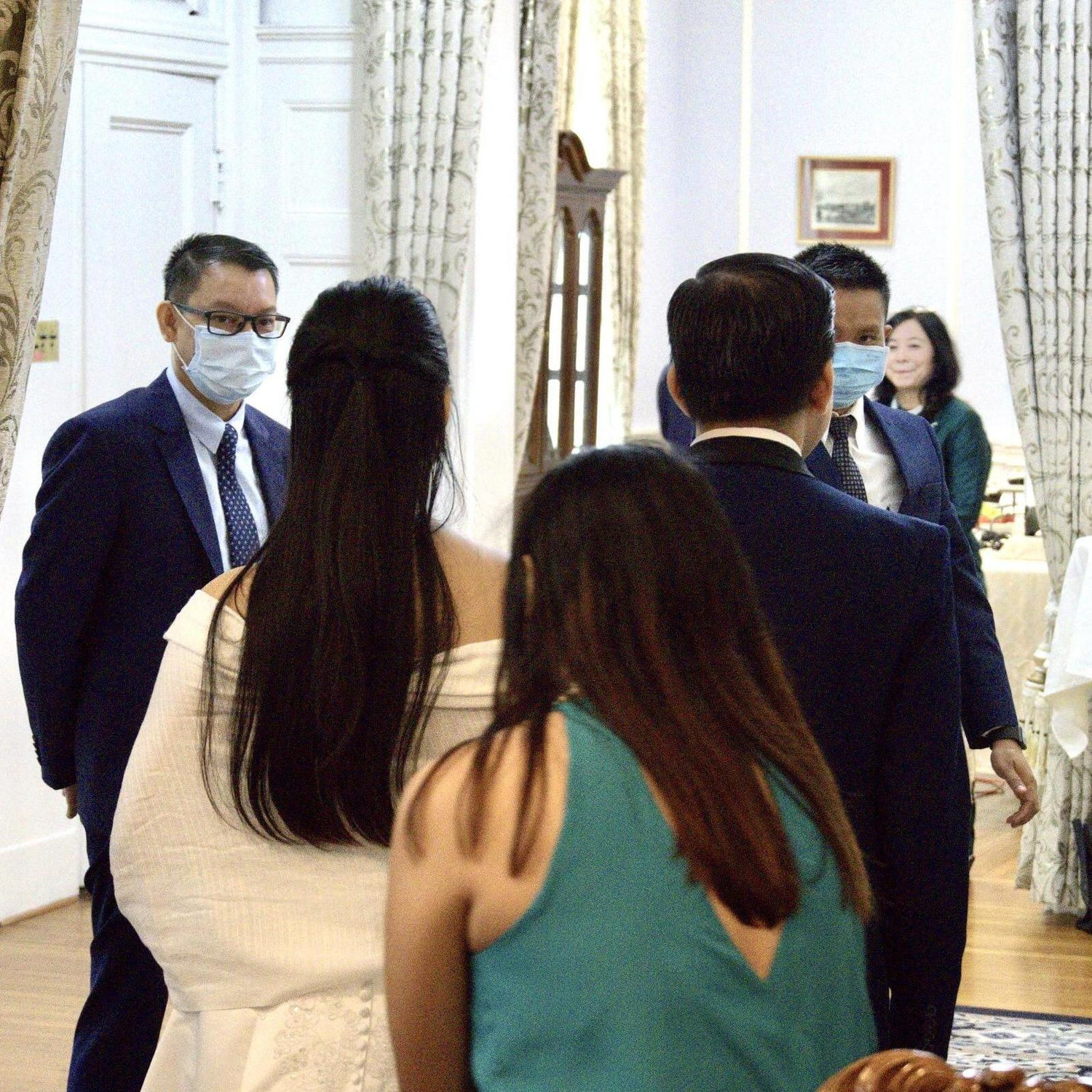 Bride and groom entering their wedding venue.