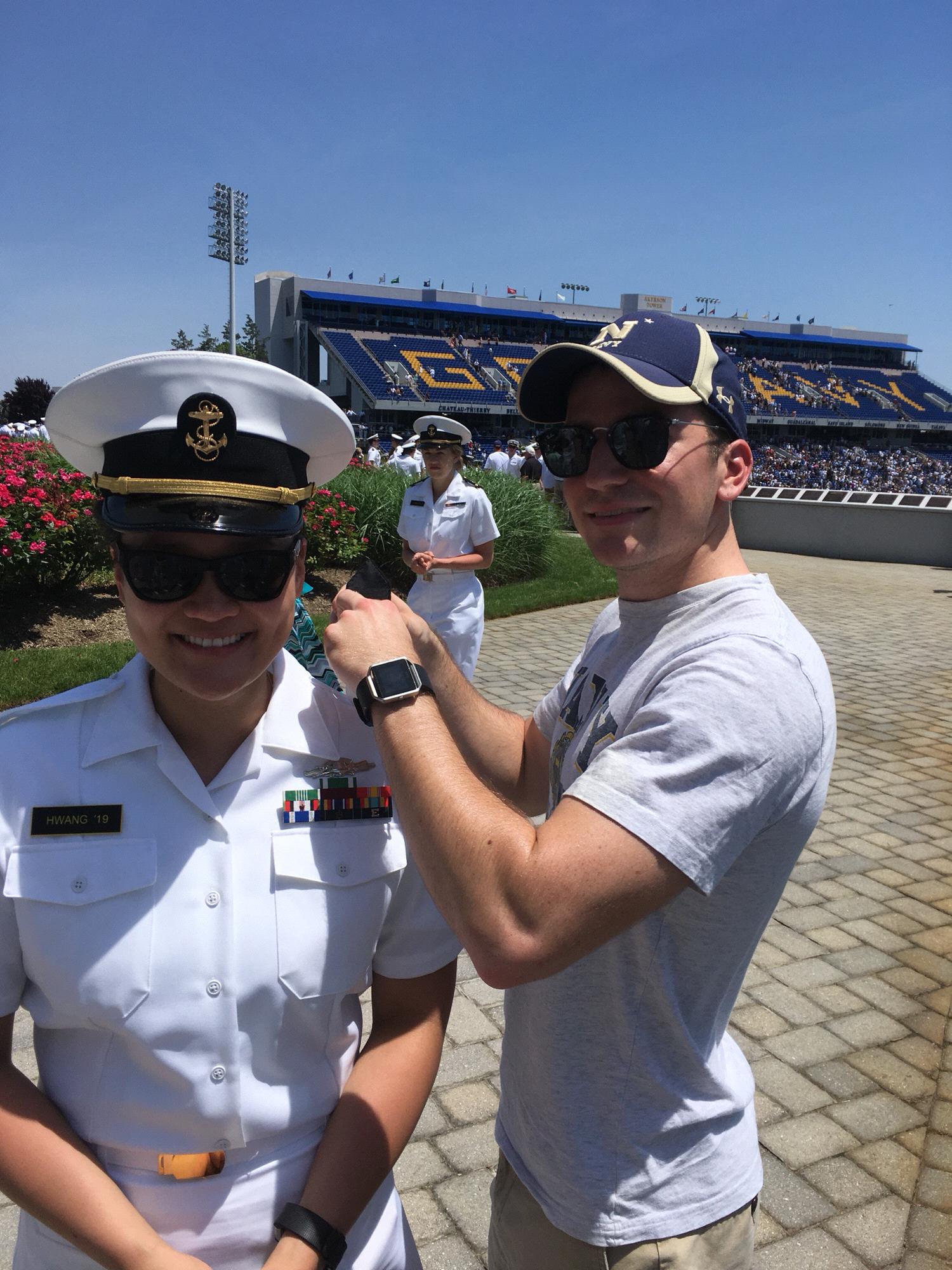 Promotion! Jack putting on Yun's new Midshipman First Class shoulder boards!