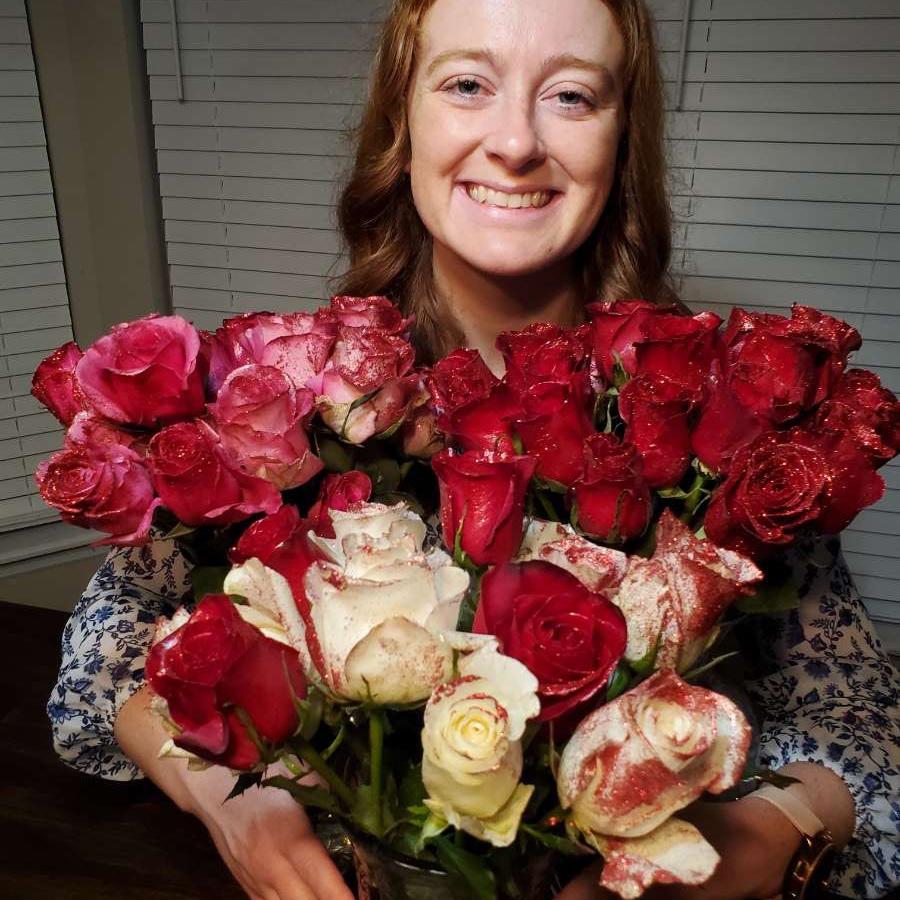 48 roses for our 1 year anniversary all rimmed with red glitter!