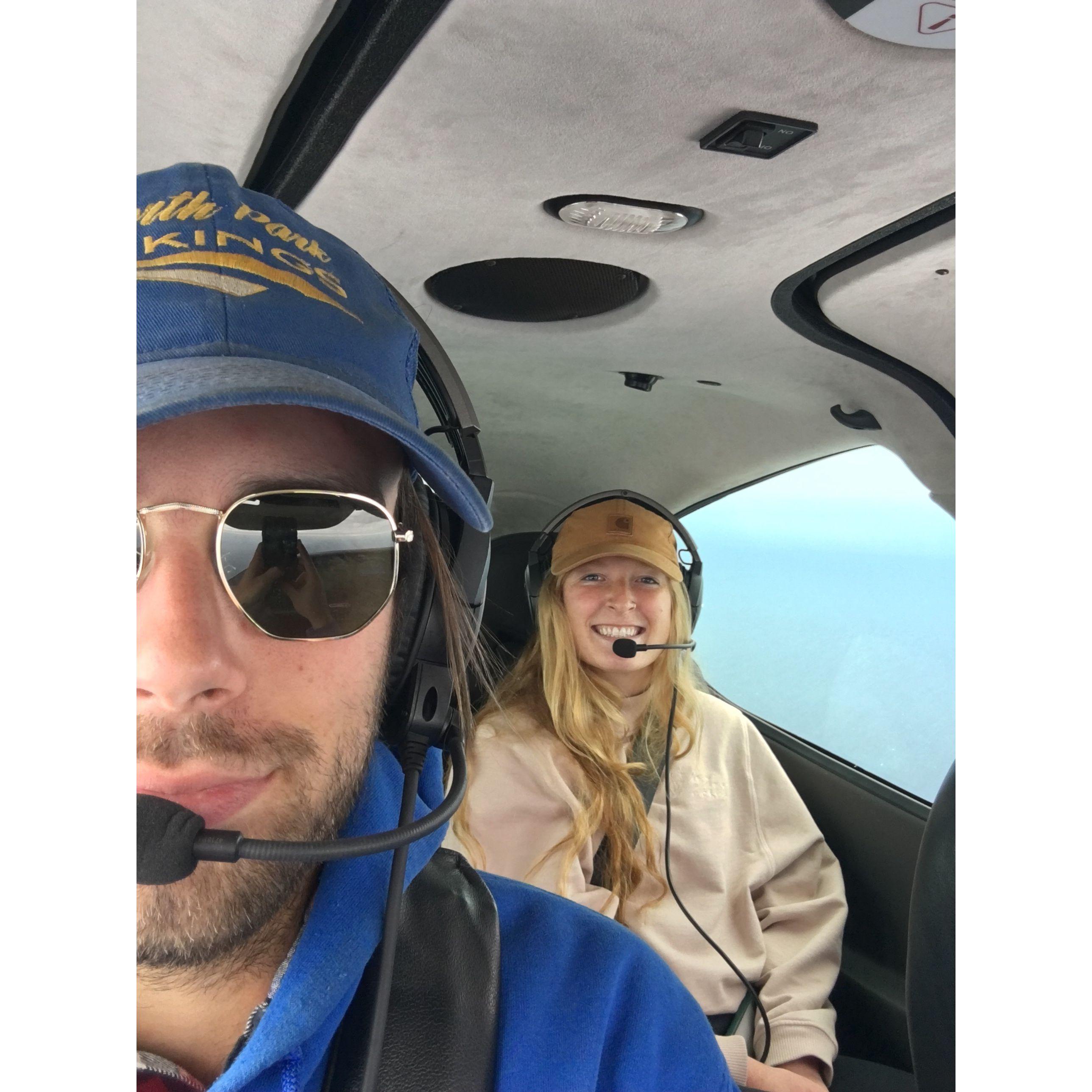 Nate and Hannah flying above Green Bay with their fearless Captain, Scott Hepler.
