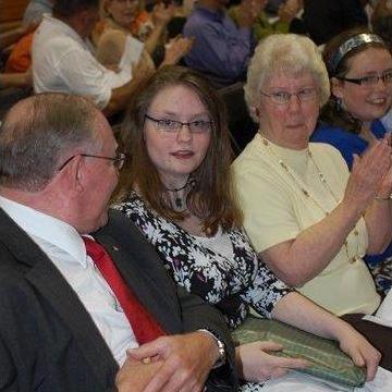Sarah receives an award at high school honors convocation and brings it back to beaming grandparents, June 2009.
