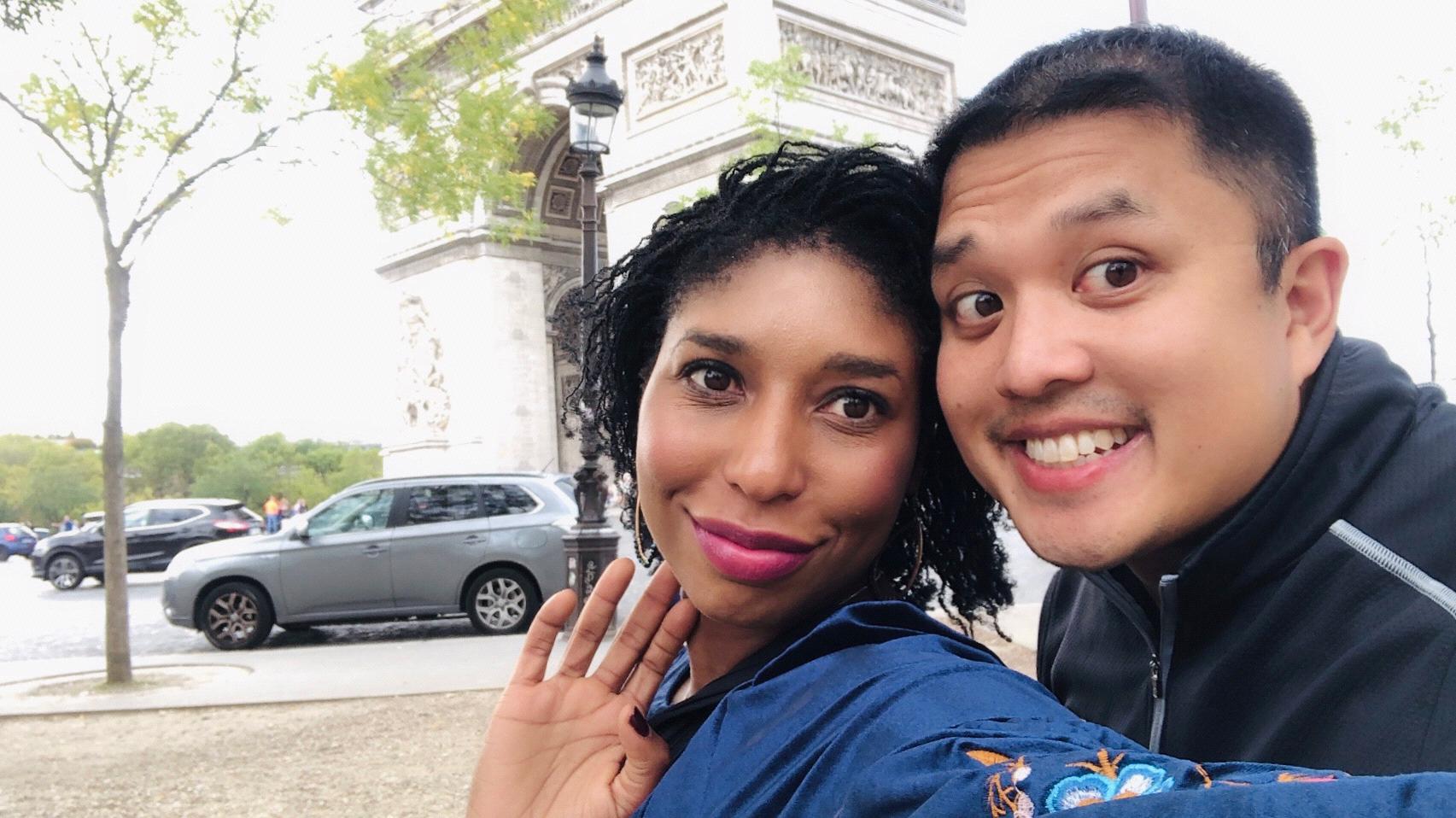 Enjoying pastries with a view of the Arc de Triomphe in Paris.