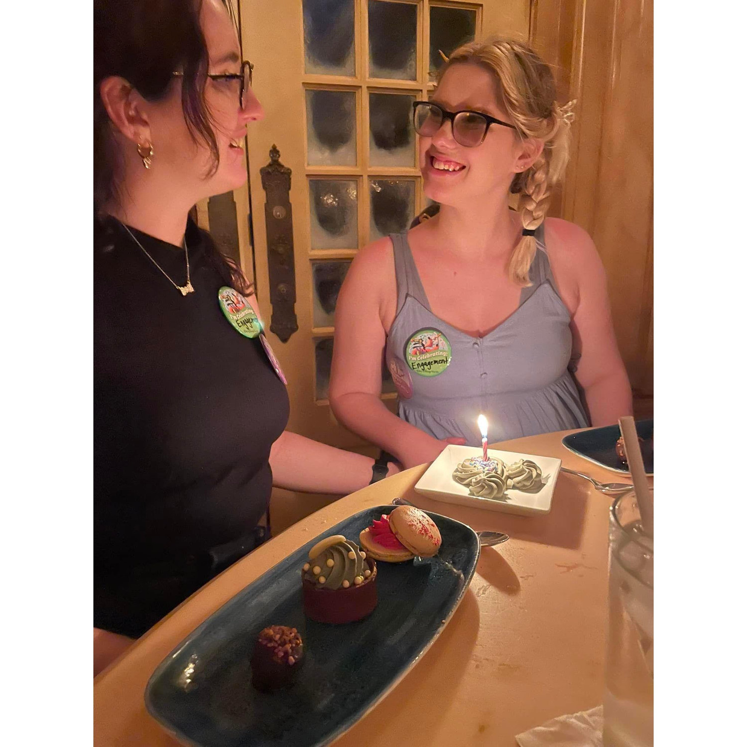 Celebrating the proposal at Belle's Castle in Disney World