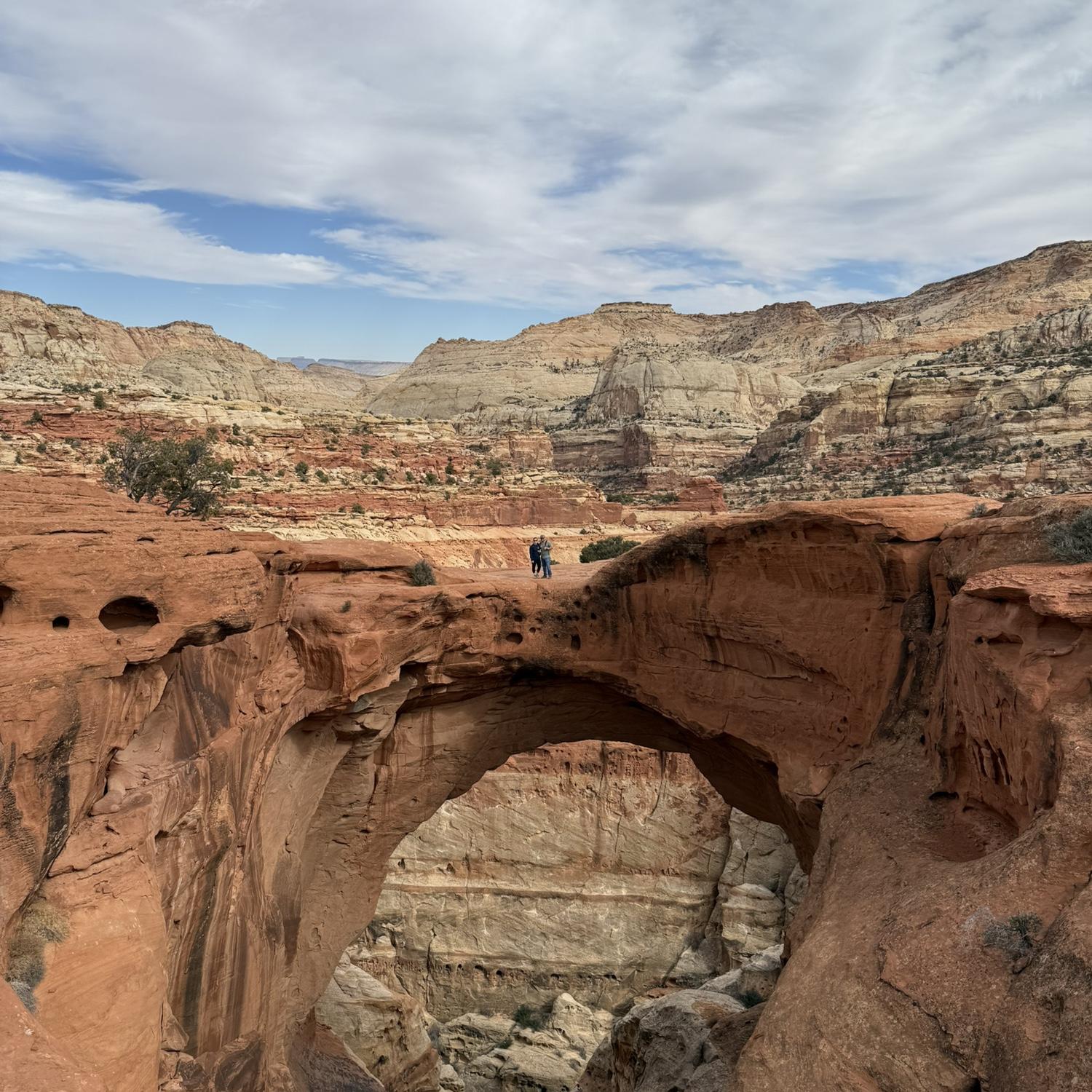 Standing on Cassidy Arch in Capitol Reef National Park