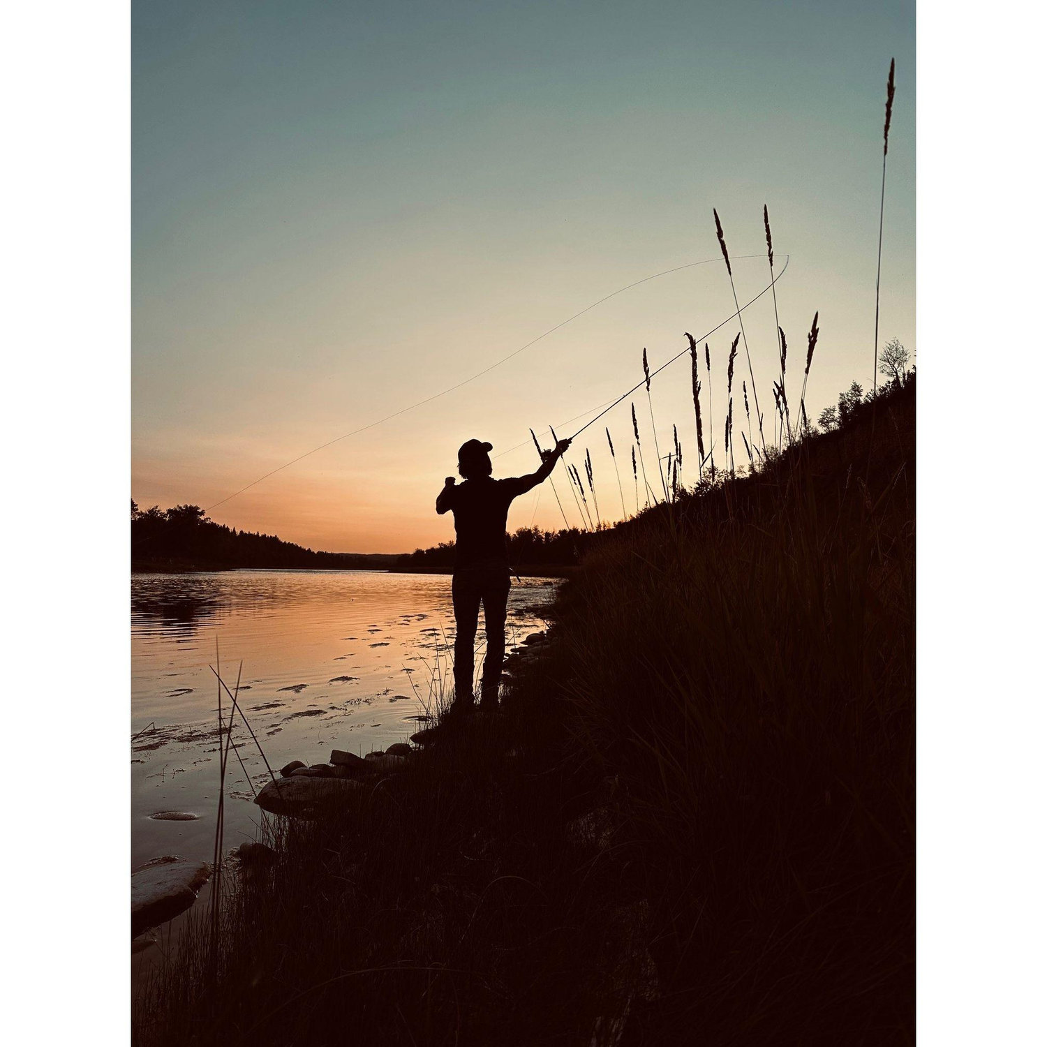 Khristen's favorite photo she snapped of Brandon fly fishing.