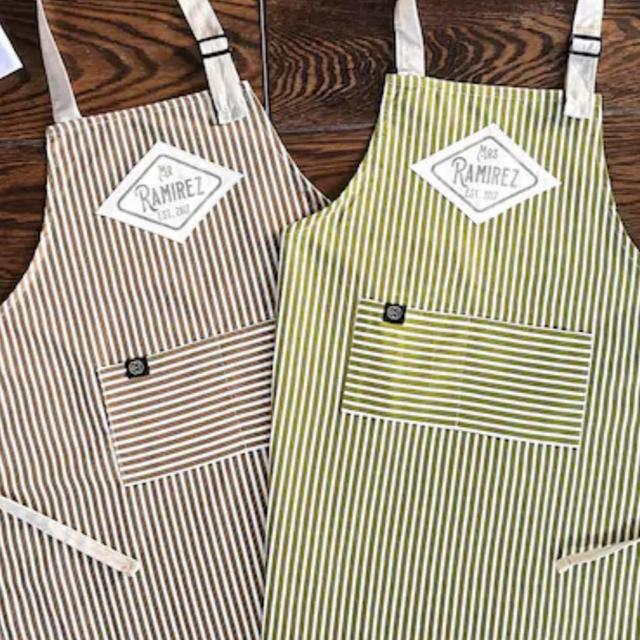 Mr and Mrs matching striped aprons.