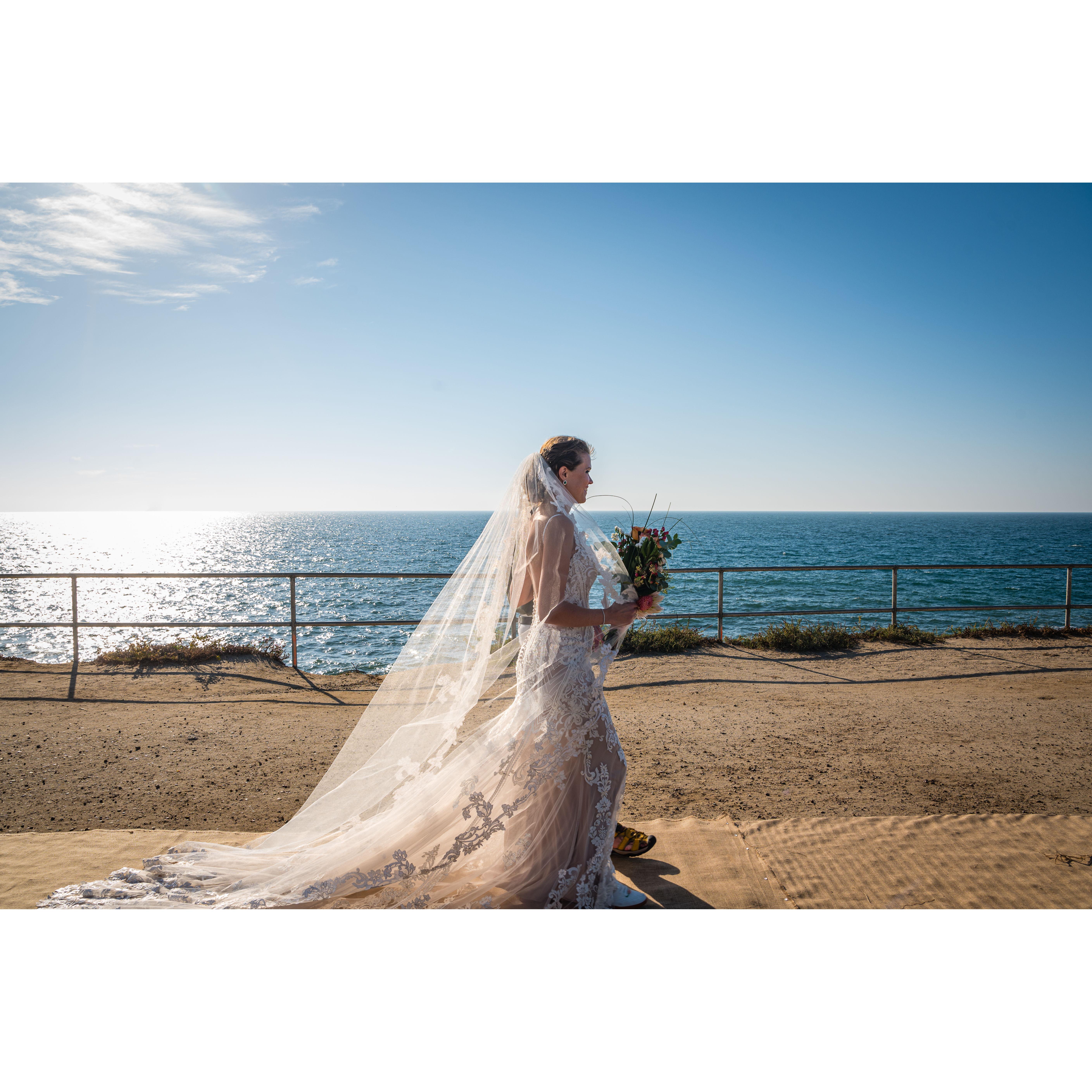 Katie and her dad (though barely visible!) walking down the aisle.