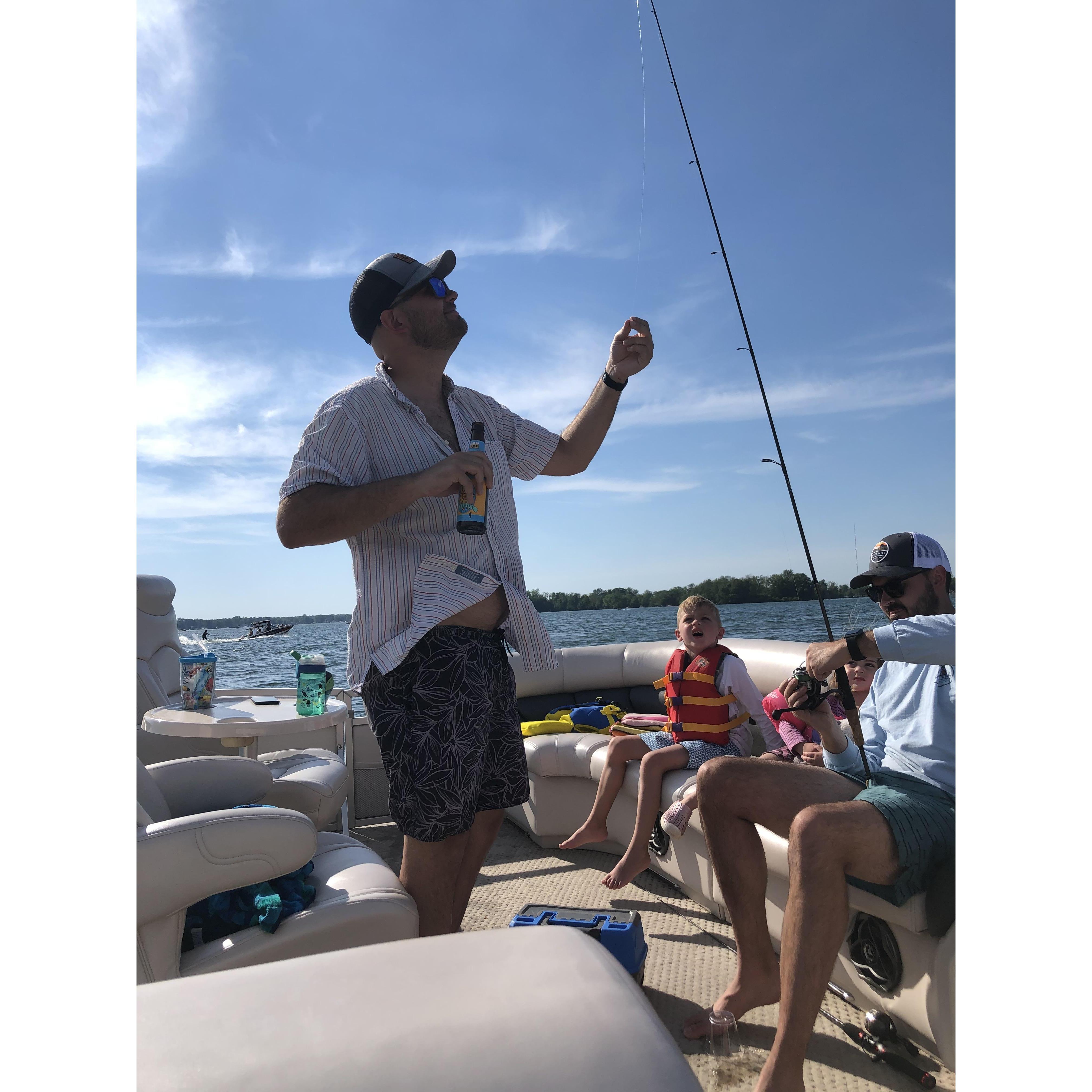 Celebrated our engagement with fishing and a champagne toast on the boat in Michigan!