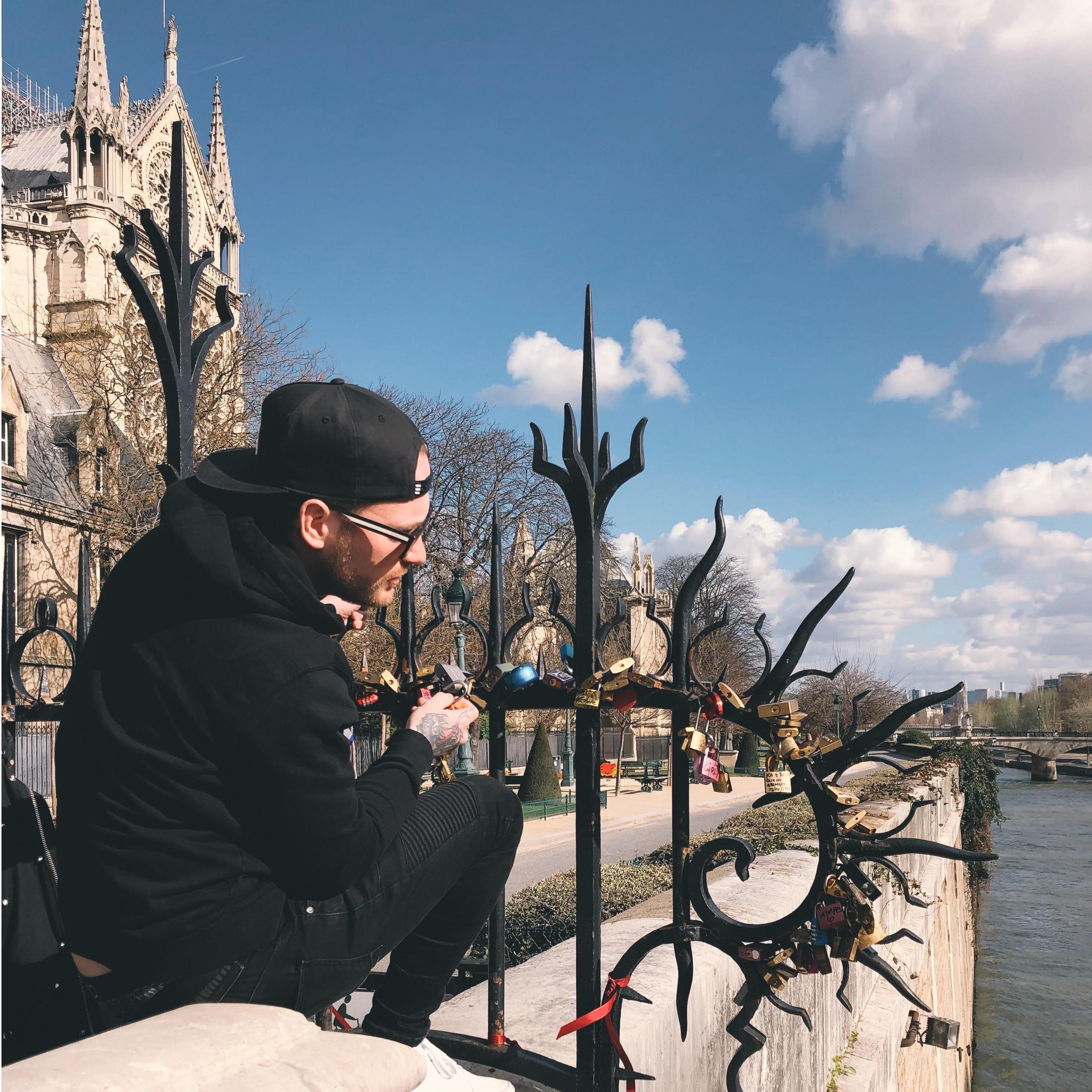 Adding our lock to the bridge in Paris