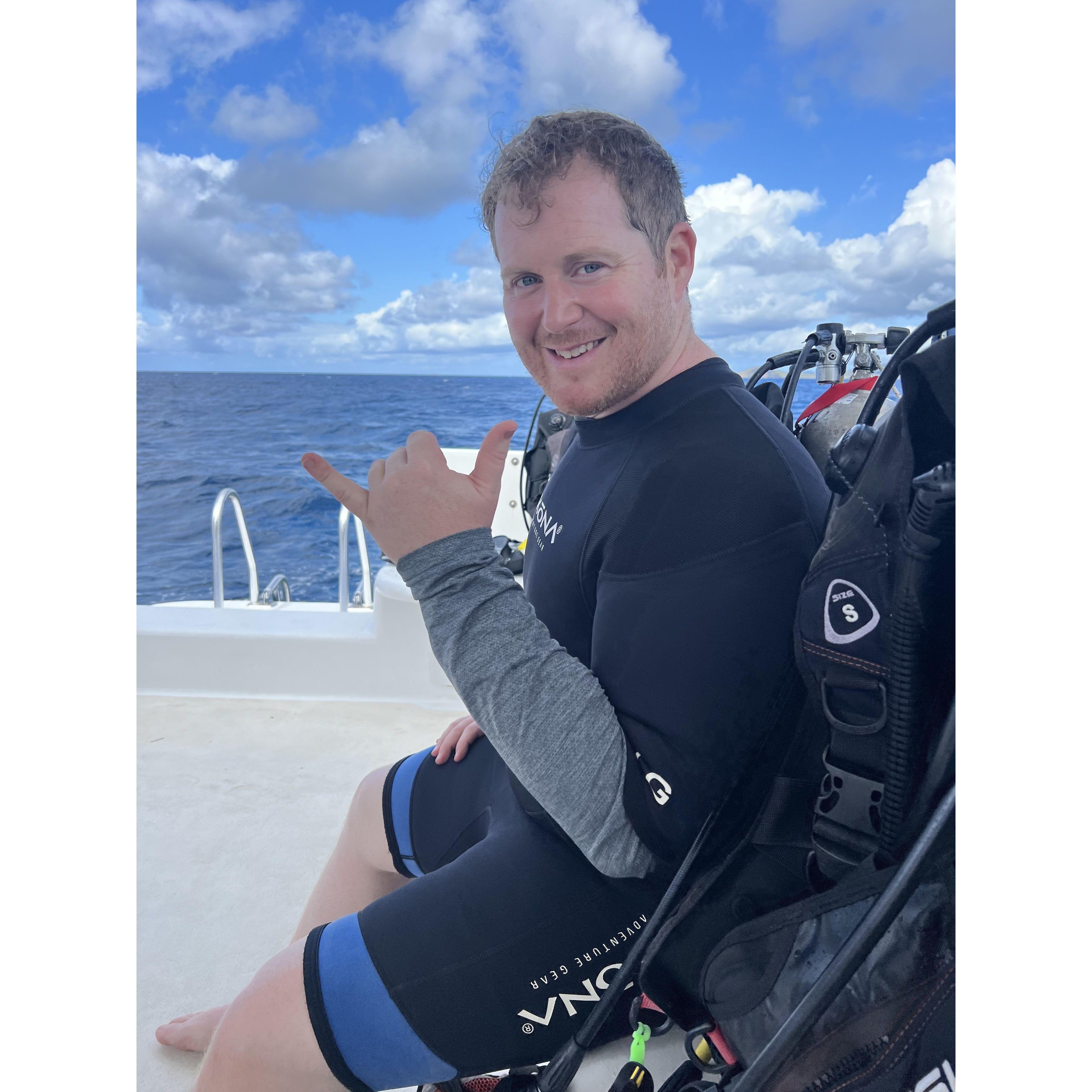 Out on his certification dives! The water was so calm we were able to go to a dive site where sharks hung out. I wasn't sure how'd he react, but he loved it and we went the next day as well!